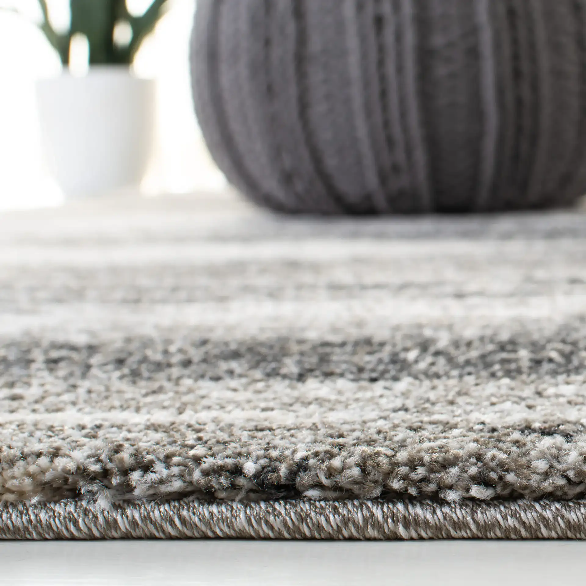 Retro Modern Striped Rug in Dark Gray / Light Gray in a styled room