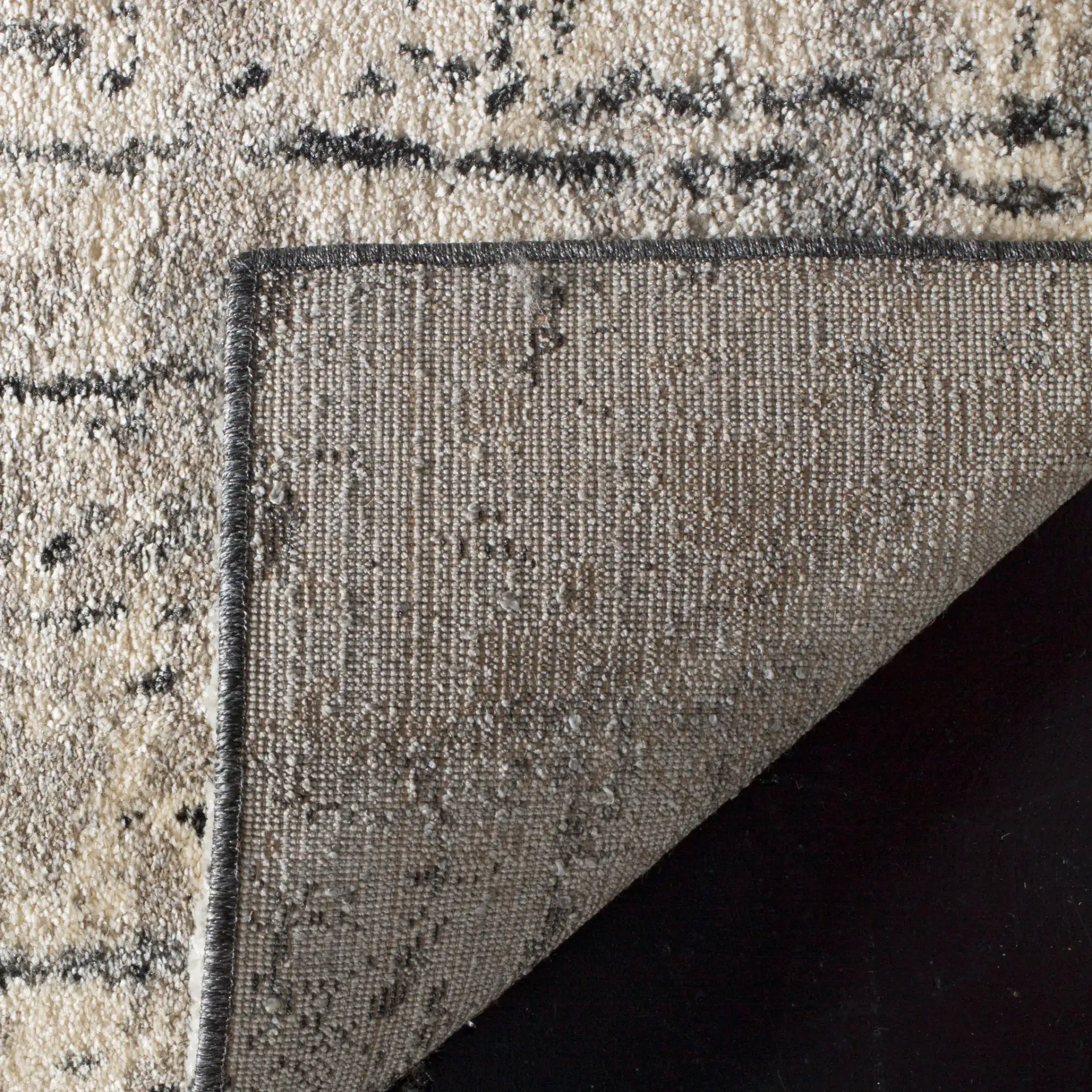 Retro Modern Ombre Rug in Black / Light Gray in a styled room