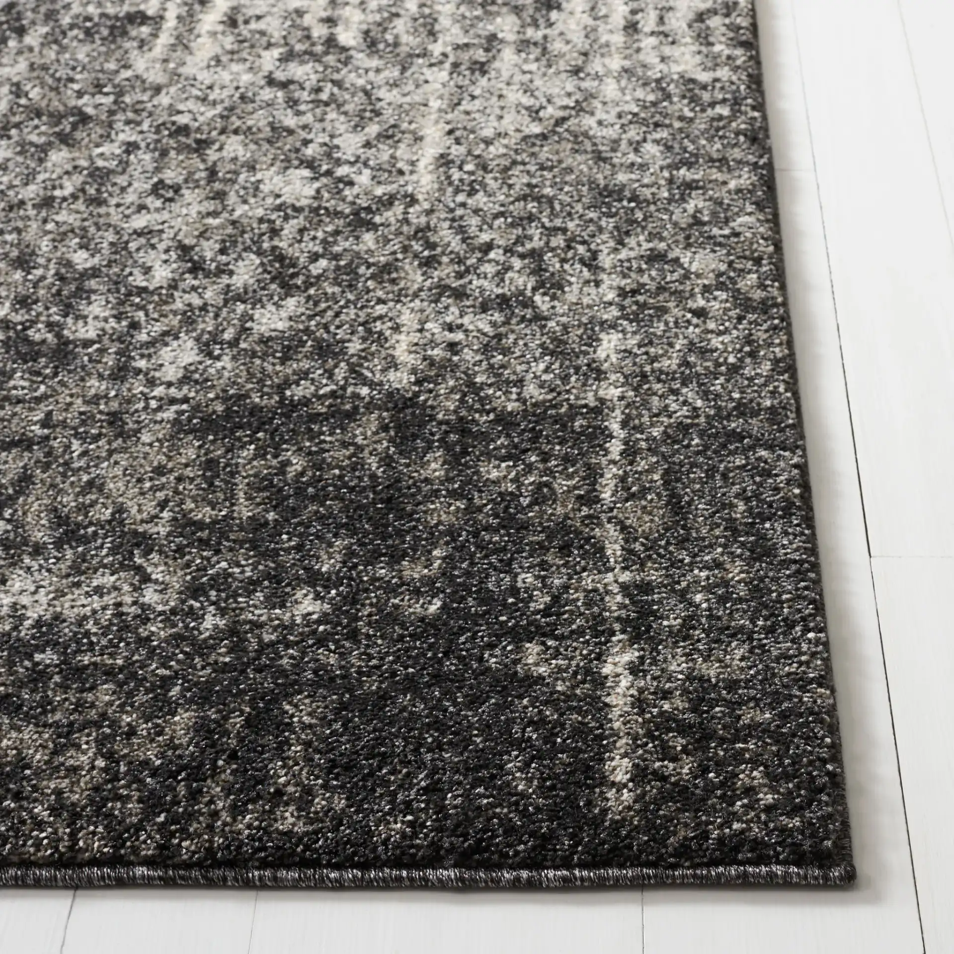 Retro Modern Ombre Rug in Black / Light Gray in a styled room