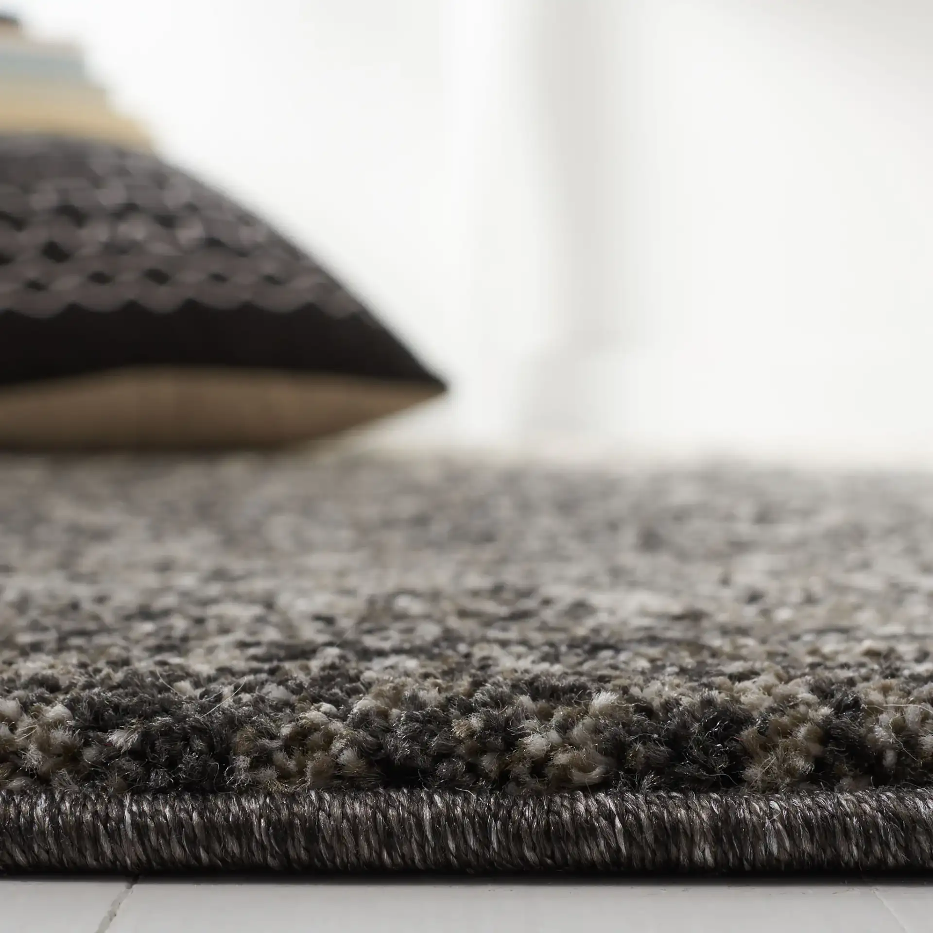 Retro Modern Ombre Rug in Black / Light Gray in a styled room