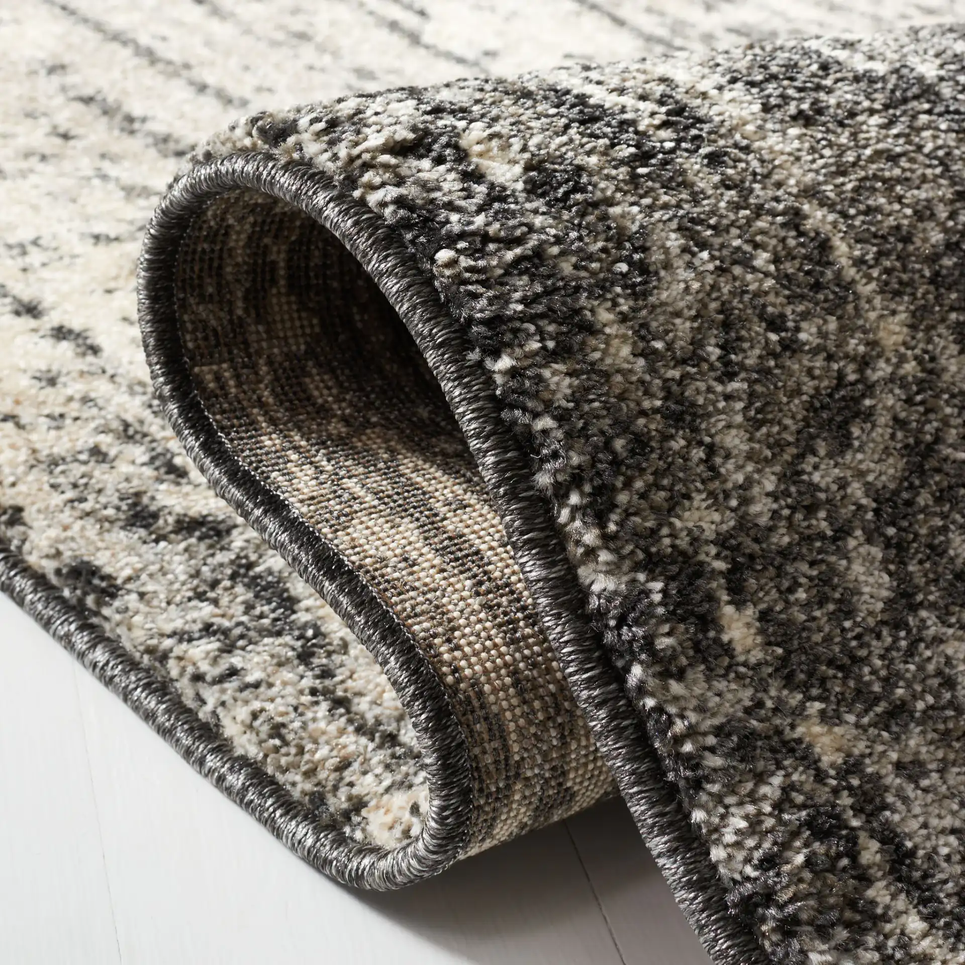 Retro Modern Ombre Rug in Black / Light Gray in a styled room