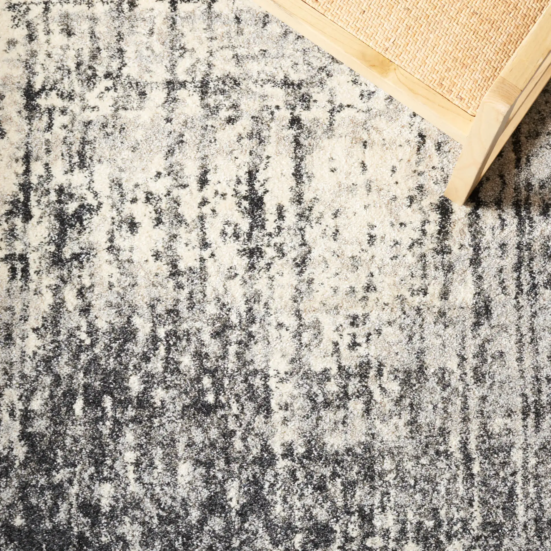 Retro Modern Ombre Rug in Black / Light Gray in a styled room