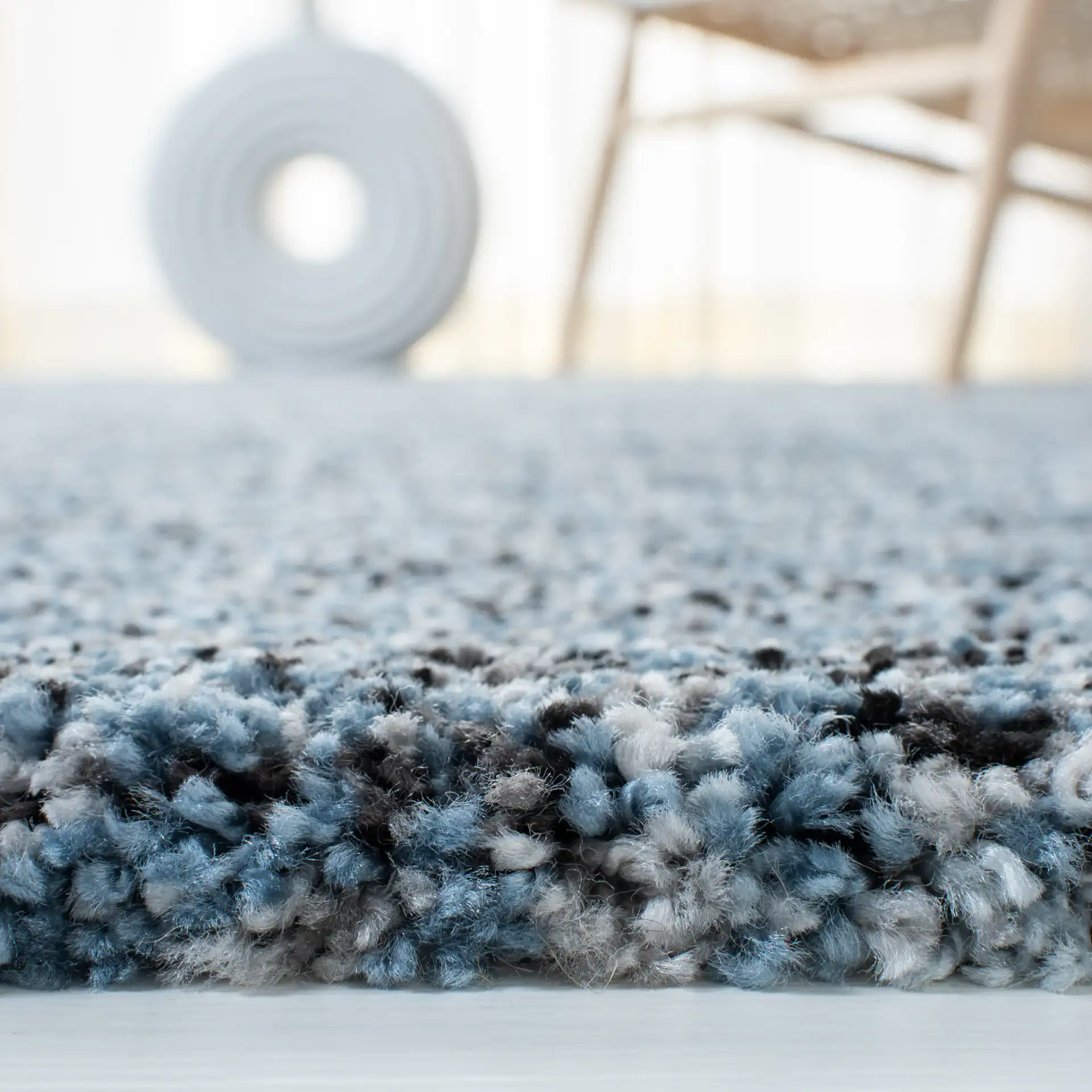 Retro Striated Solid Rug in Gray / Blue in a styled room
