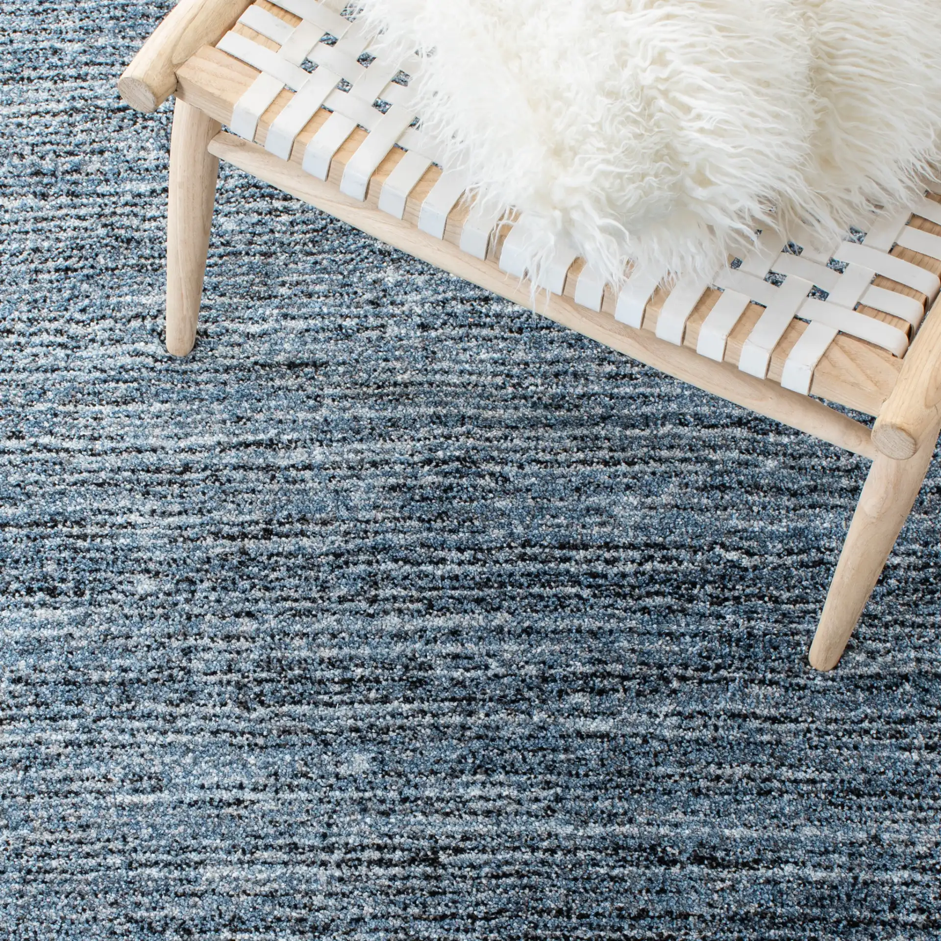 Retro Striated Solid Rug in Gray / Blue in a styled room