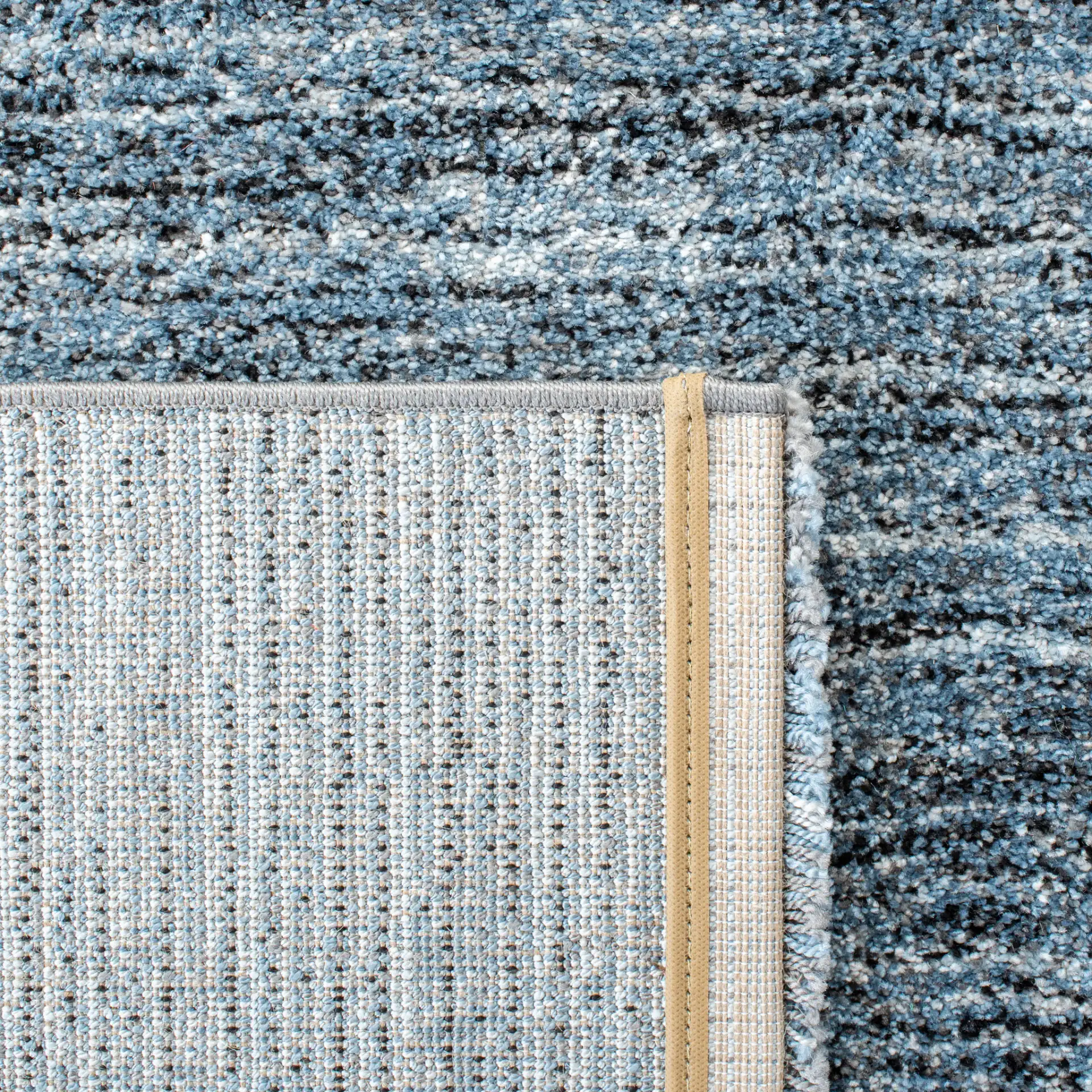 Retro Striated Solid Rug in Gray / Blue in a styled room