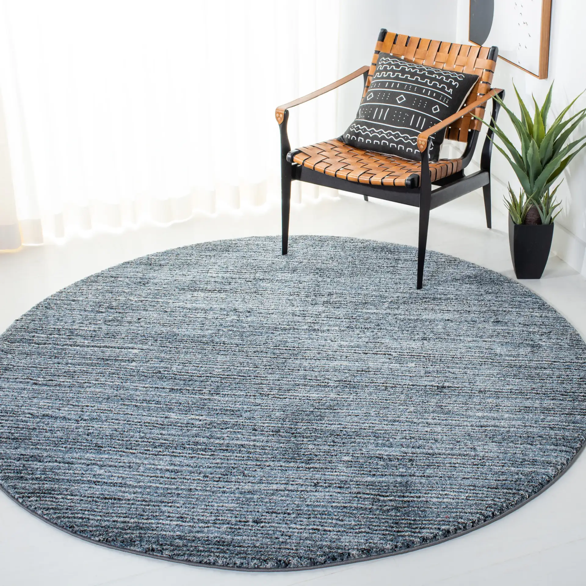 Retro Striated Solid Rug in Gray / Blue in a styled room