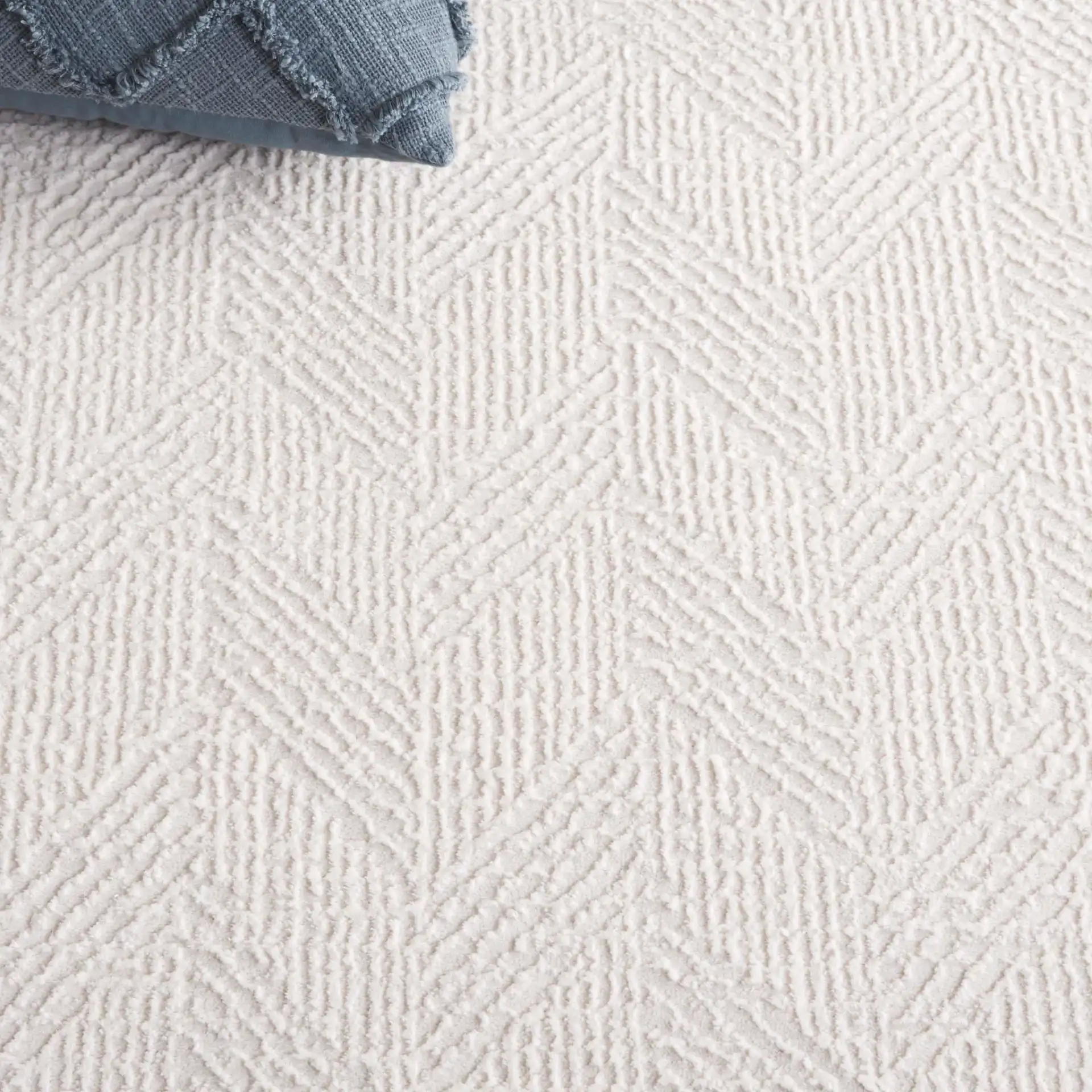 Revive Herringbone Rug in Ivory in a styled room