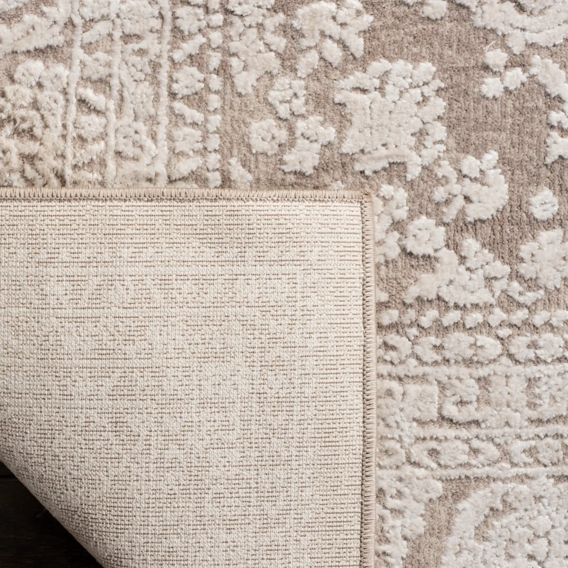 Reflection Distressed Medallion Rug in Beige / Cream in a styled room
