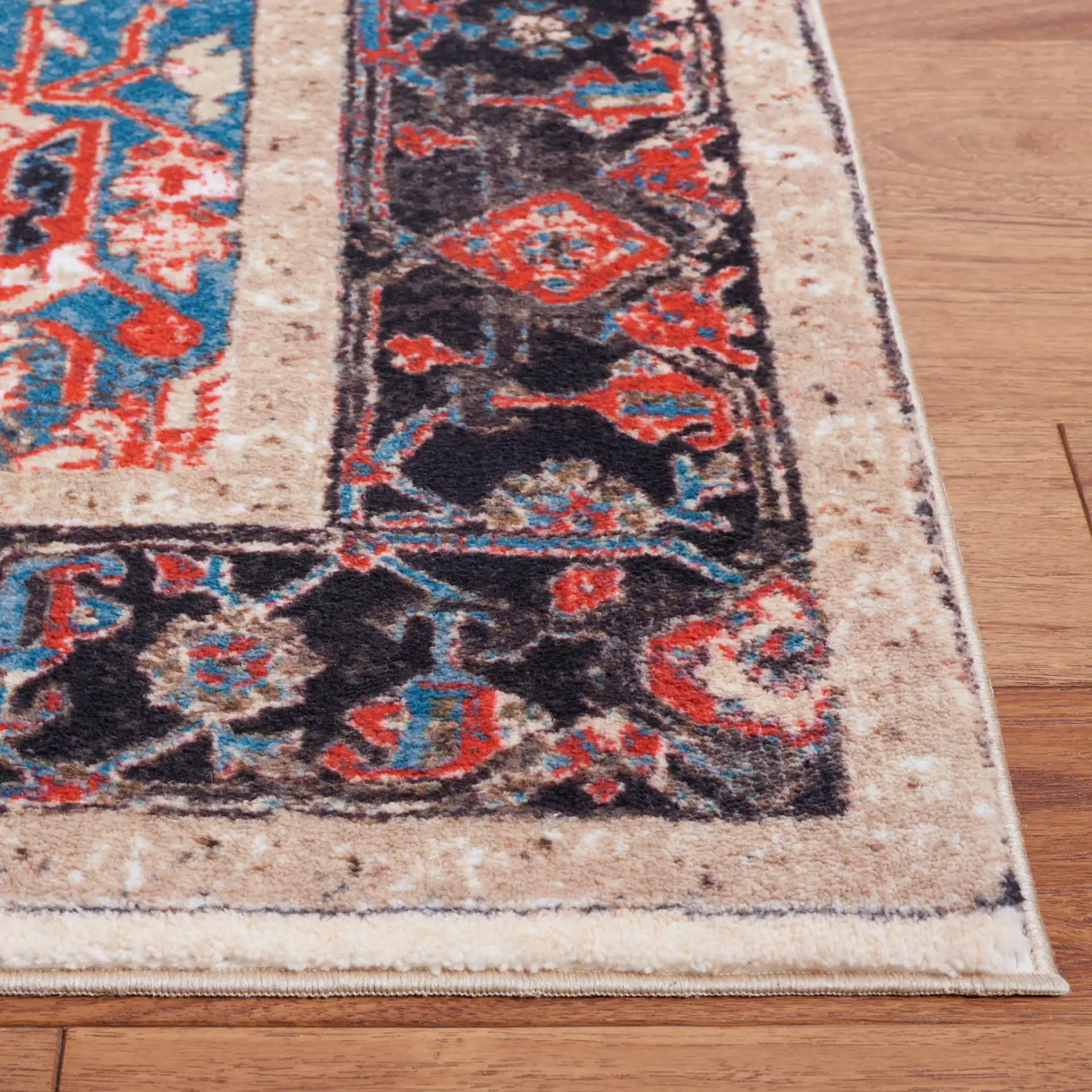 Riviera Medallion Bordered Washable Rug in Ivory / Blue in a styled room