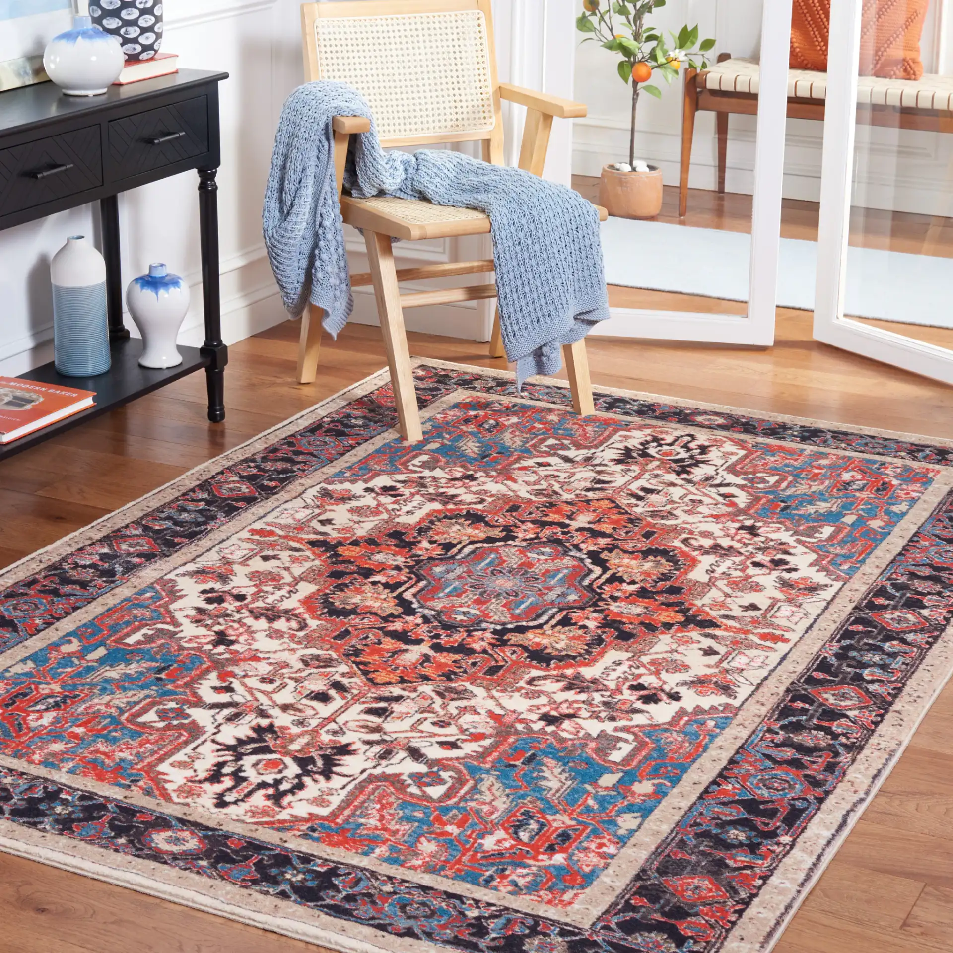 Riviera Medallion Bordered Washable Rug in Ivory / Blue in a styled room