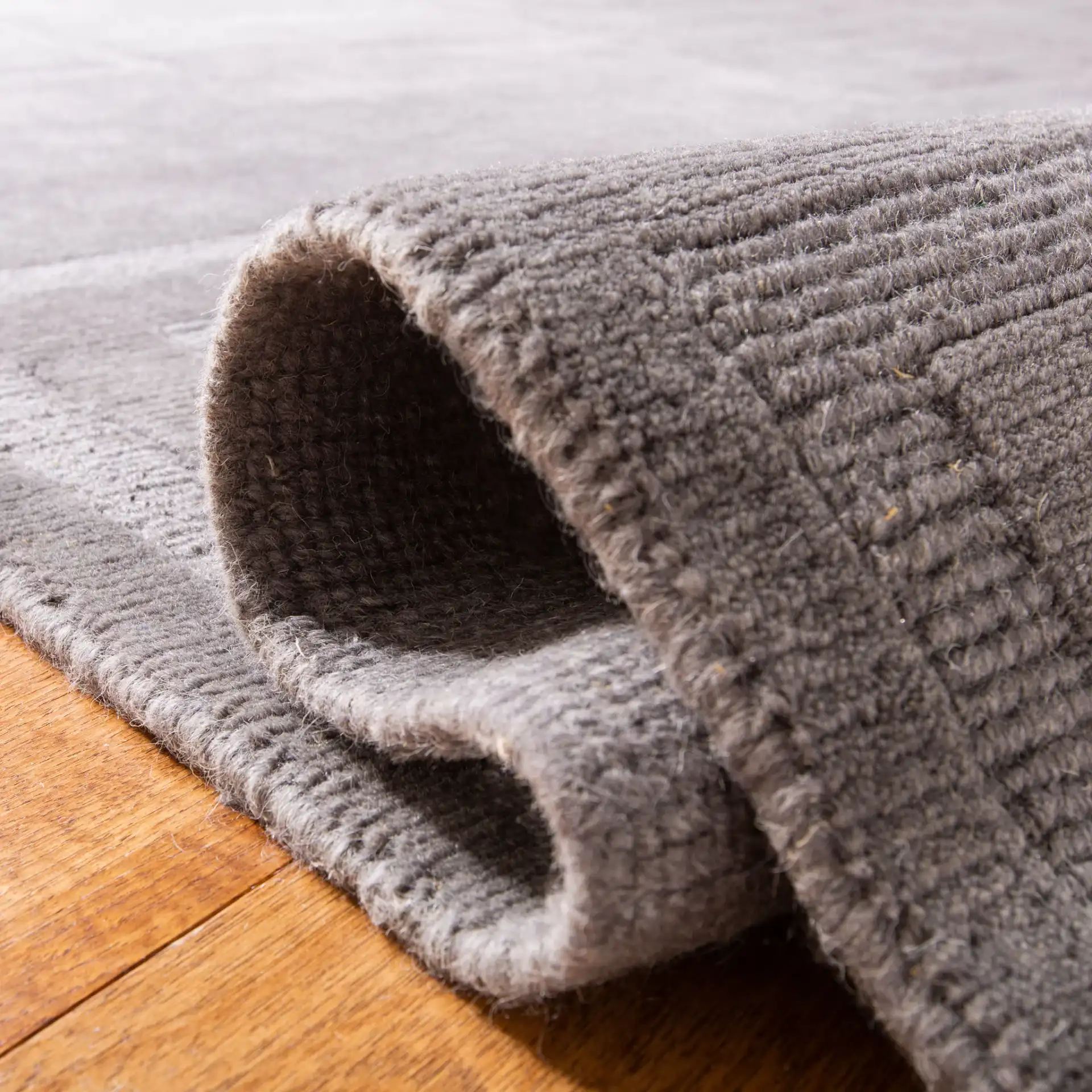 Ralph Lauren Roxy Hand-Knotted Wool Rug in Slate / Tonal in a styled room