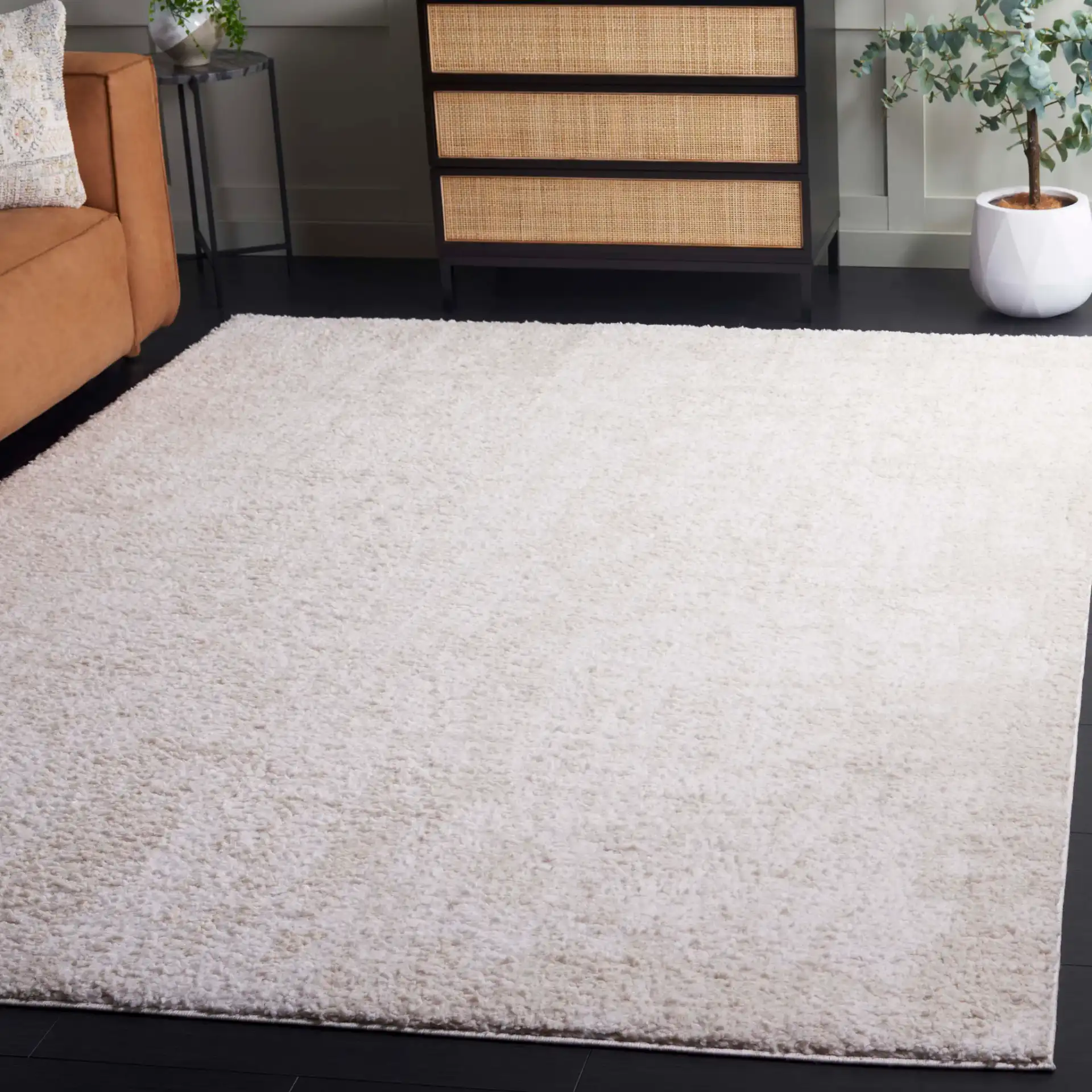 Rumi Textured Heathered Shag Rug in Ivory / Light Beige in a styled room
