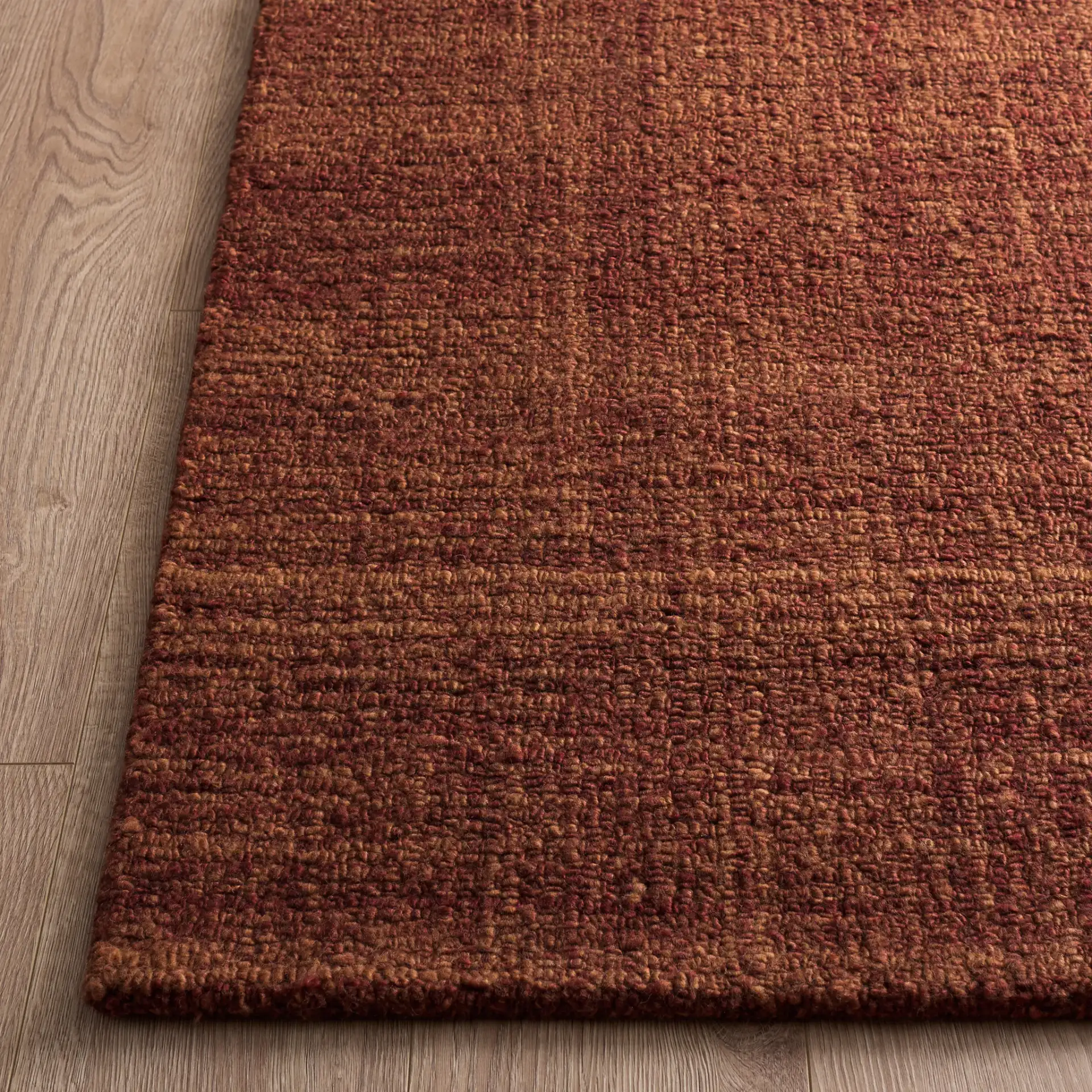 Renewal Crosshatch Hand-Tufted Rug in Rust in a styled room