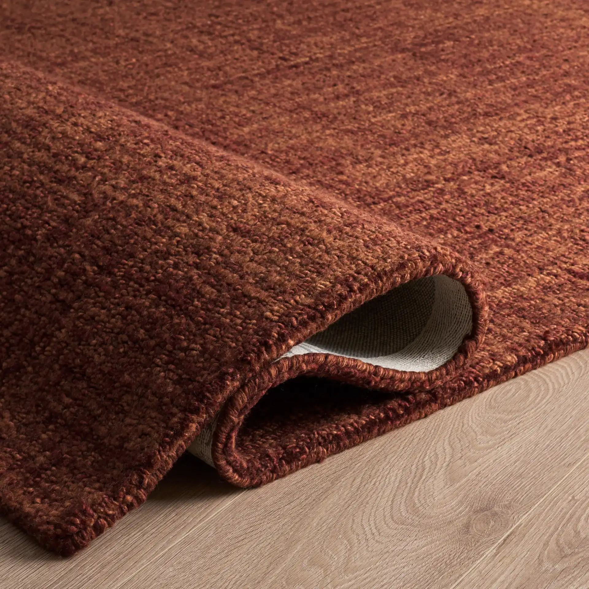 Renewal Crosshatch Hand-Tufted Rug in Rust in a styled room