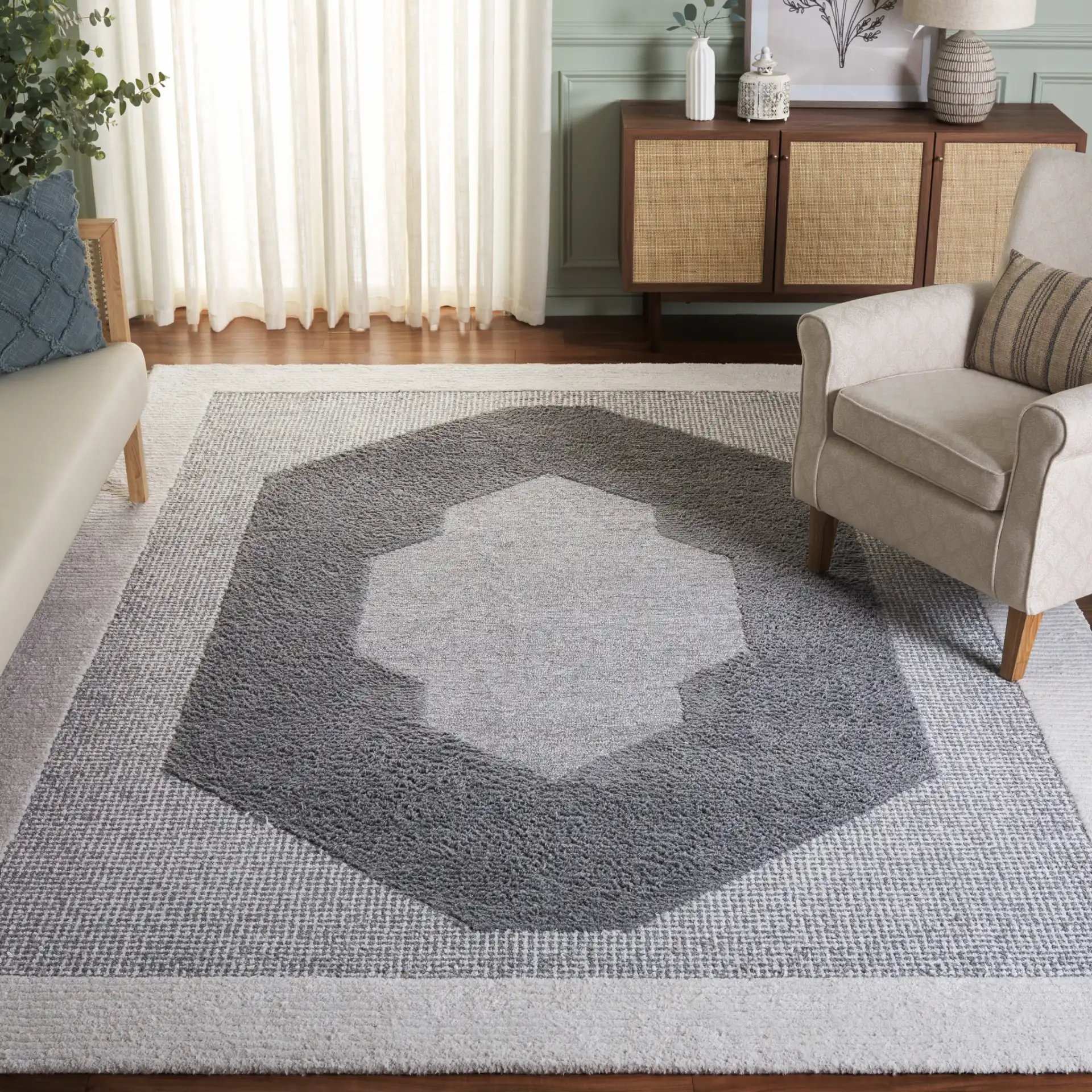 Renewal Concentric Medallion Hand-Tufted Rug in Dark Gray / Ivory in a styled room