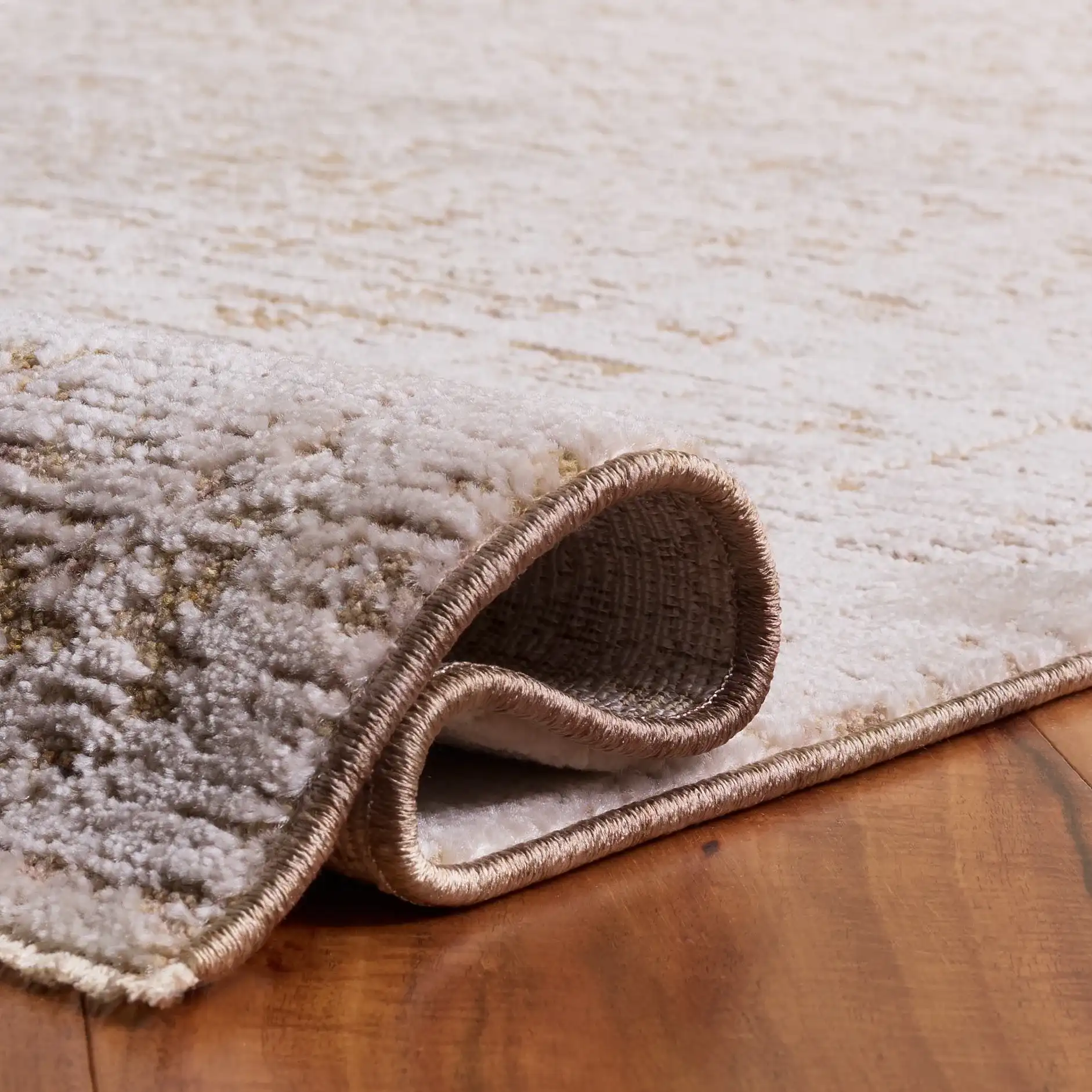Romance Distressed Tile Rug in Ivory / Brown in a styled room
