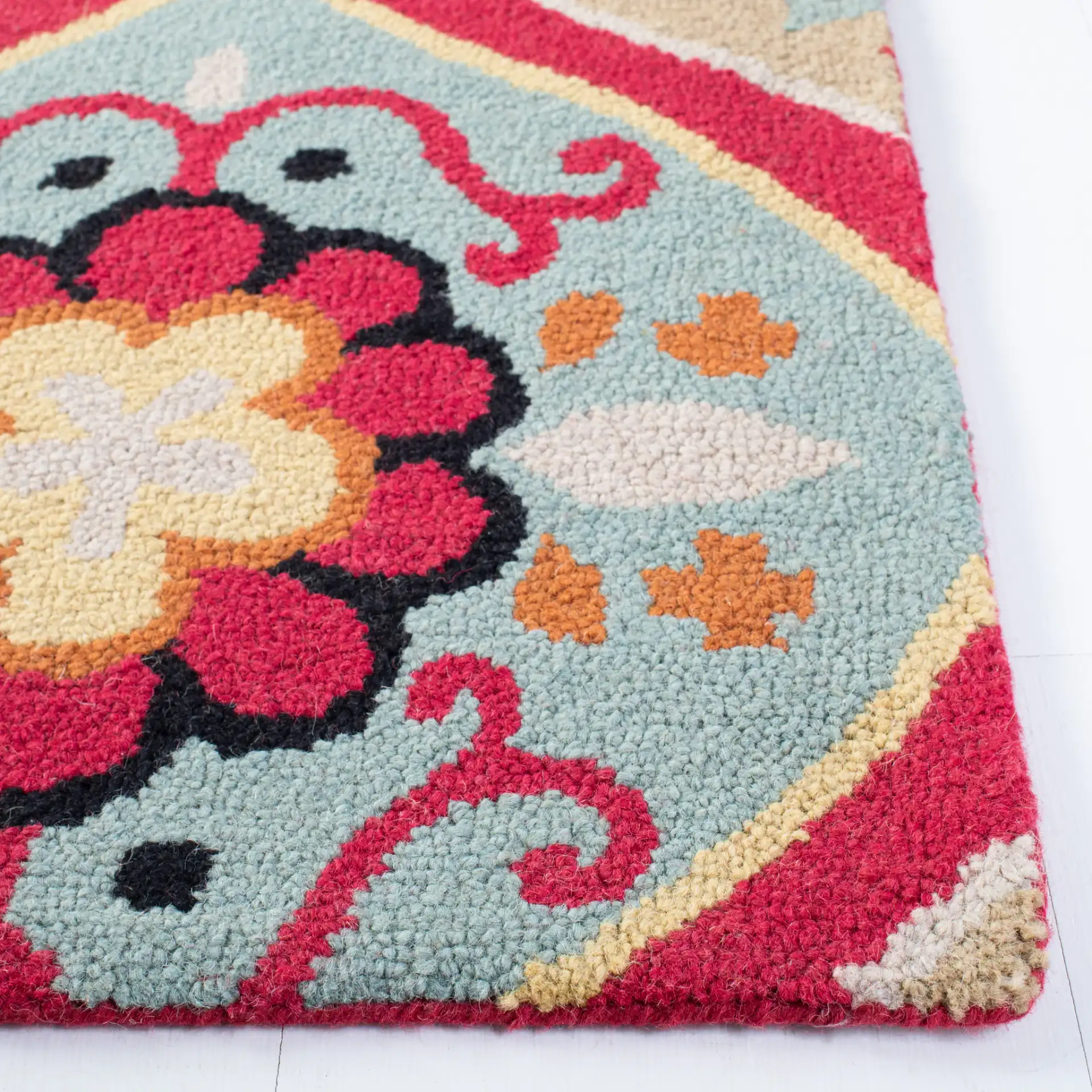 Roslyn Floral Medallion Hand-Tufted Wool Rug in Blue / Multicolor in a styled room