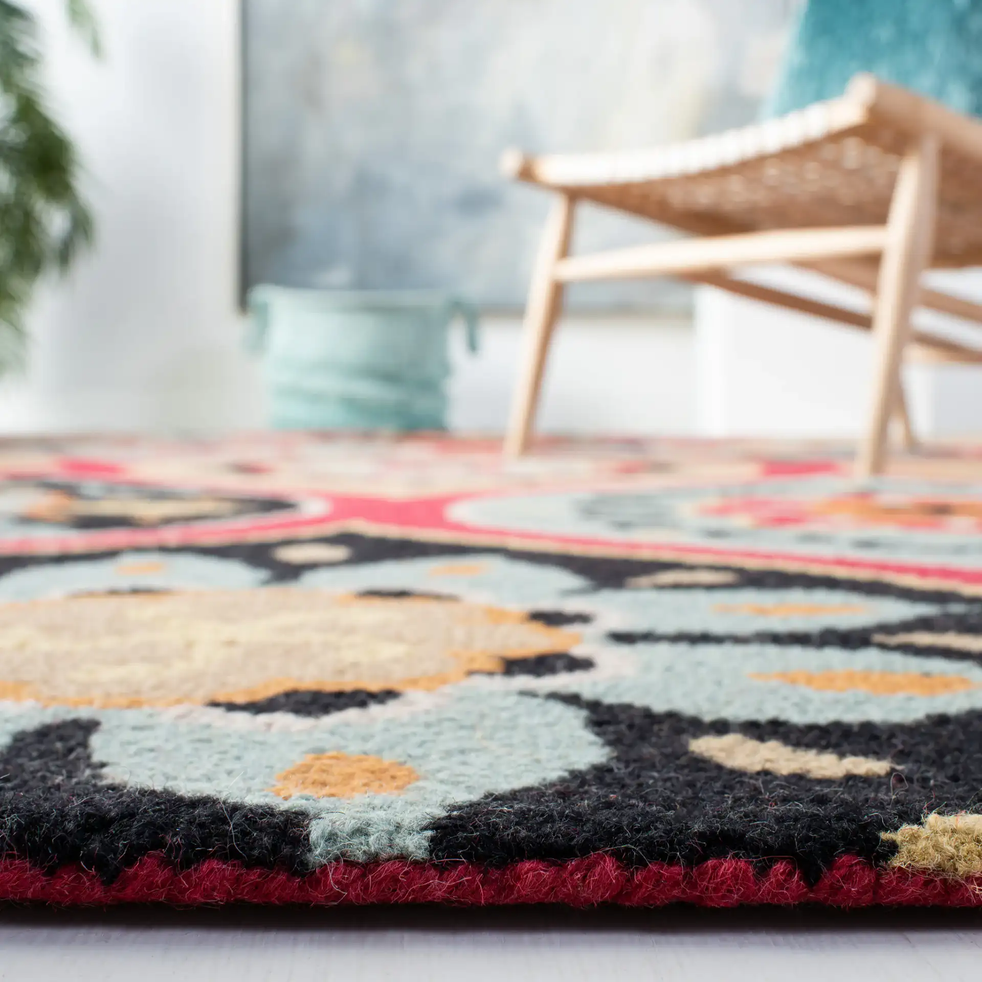 Roslyn Floral Medallion Hand-Tufted Wool Rug in Blue / Multicolor in a styled room