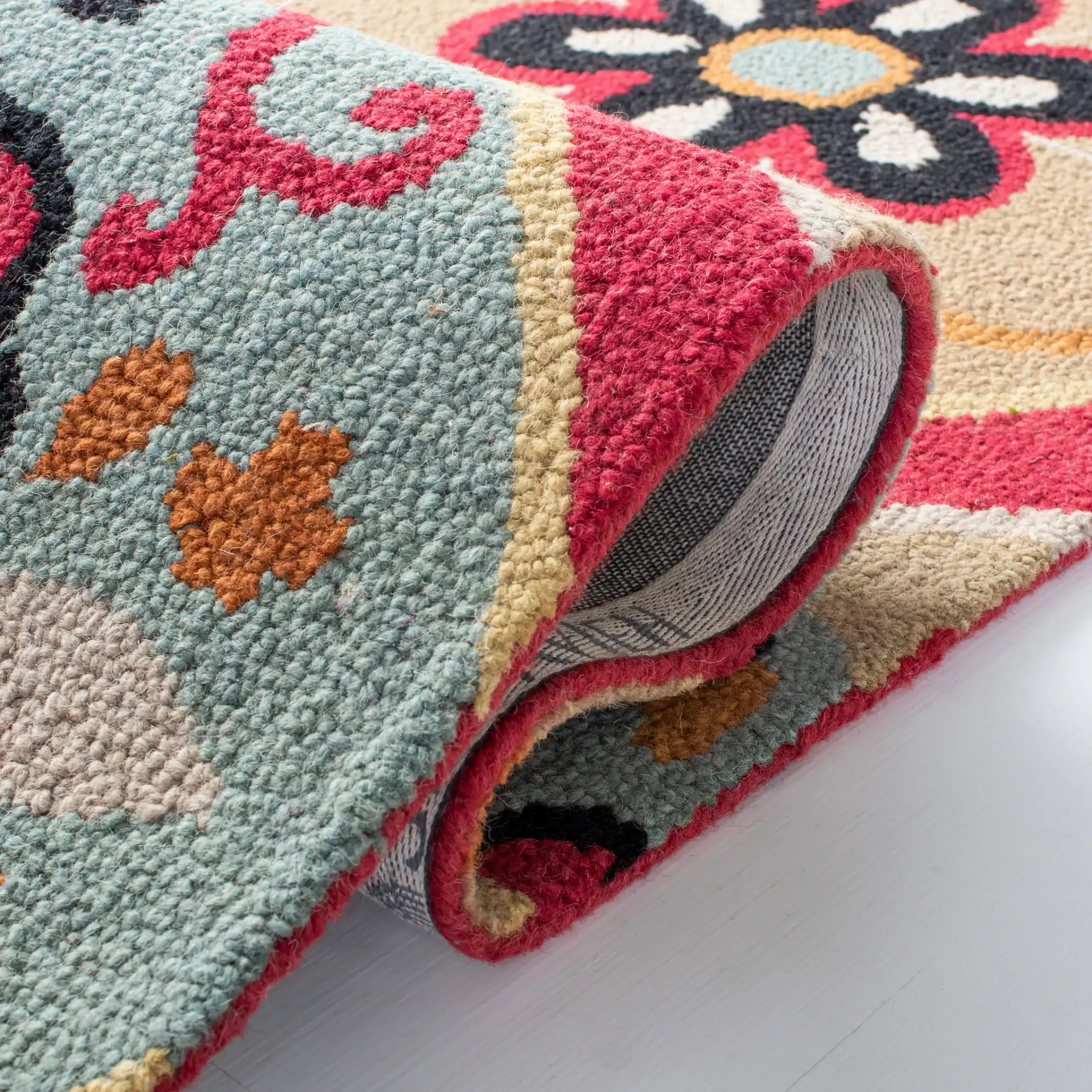 Roslyn Floral Medallion Hand-Tufted Wool Rug in Blue / Multicolor in a styled room