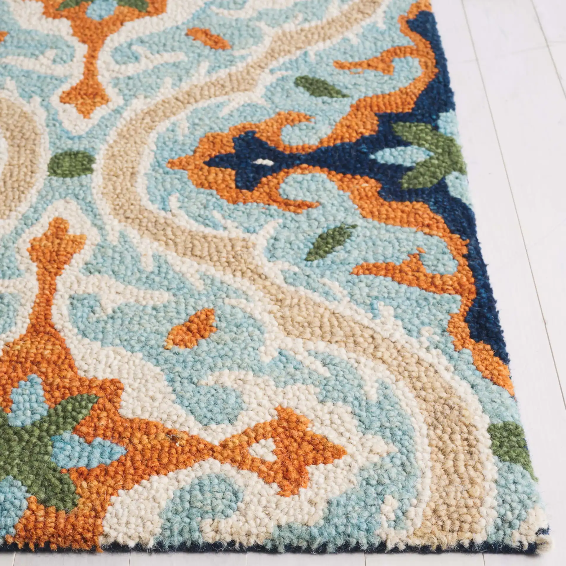 Roslyn Ogee Hand-Tufted Wool Rug in Blue / Beige in a styled room