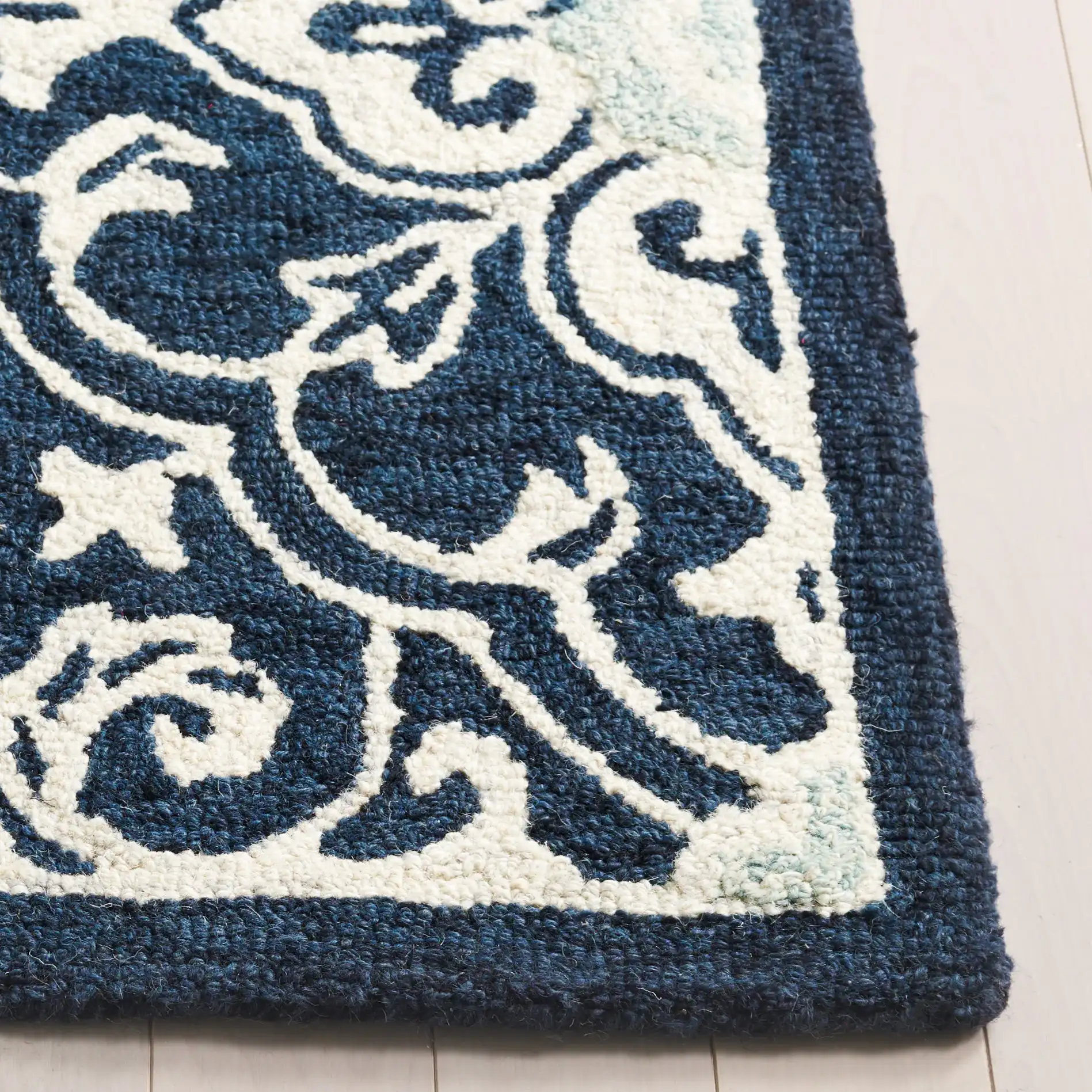 Roslyn Interlocking Tile Hand-Tufted Wool Rug in Navy / Light Blue in a styled room