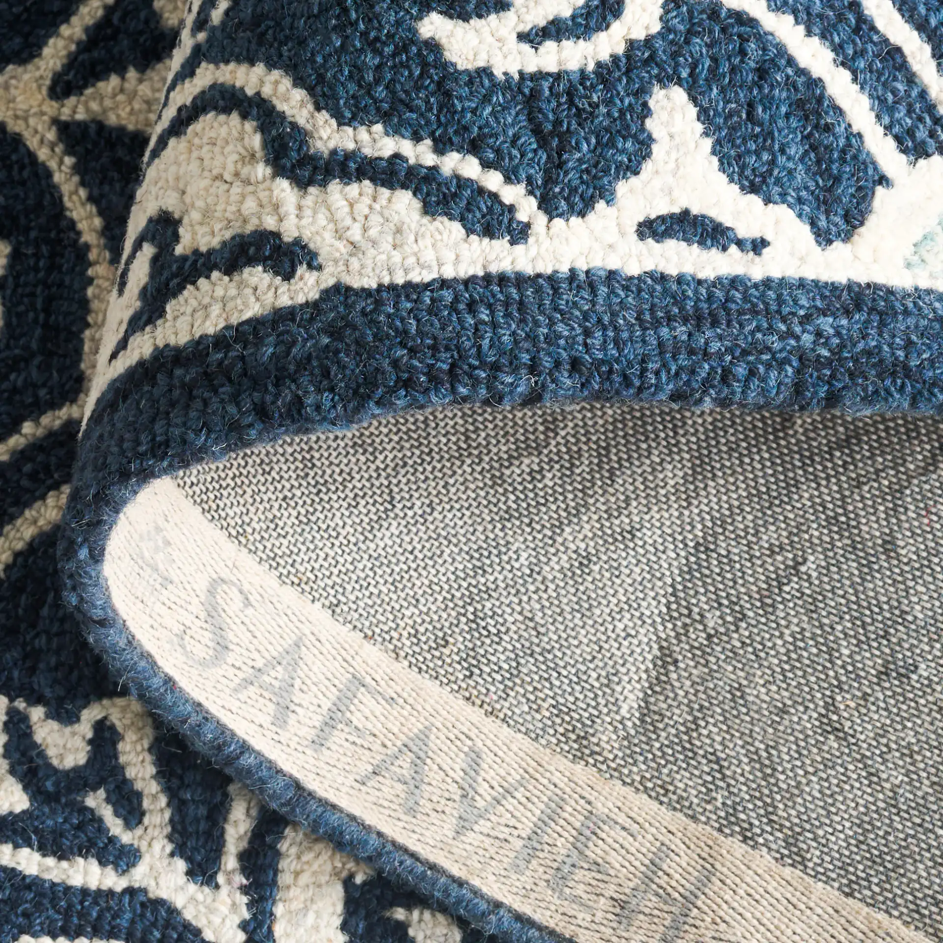 Roslyn Interlocking Tile Hand-Tufted Wool Rug in Navy / Light Blue in a styled room