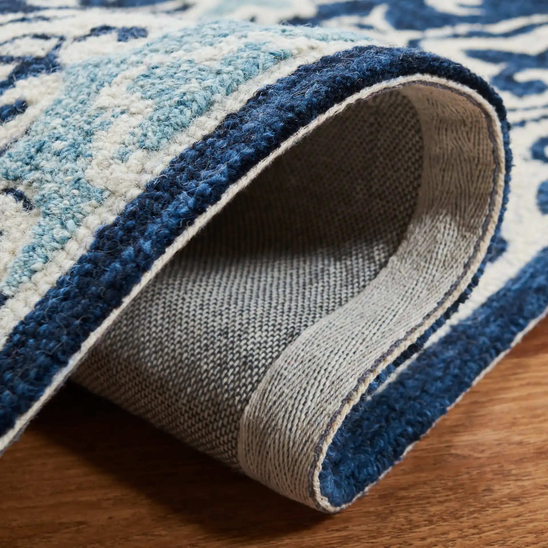 Roslyn Interlocking Tile Hand-Tufted Wool Rug in Navy / Light Blue in a styled room