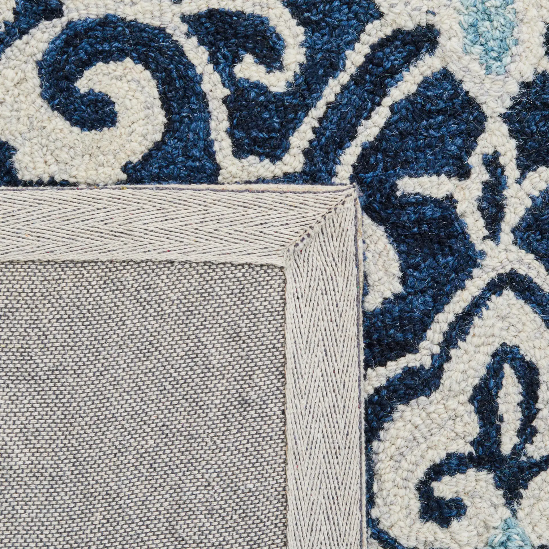 Roslyn Interlocking Tile Hand-Tufted Wool Rug in Navy / Light Blue in a styled room