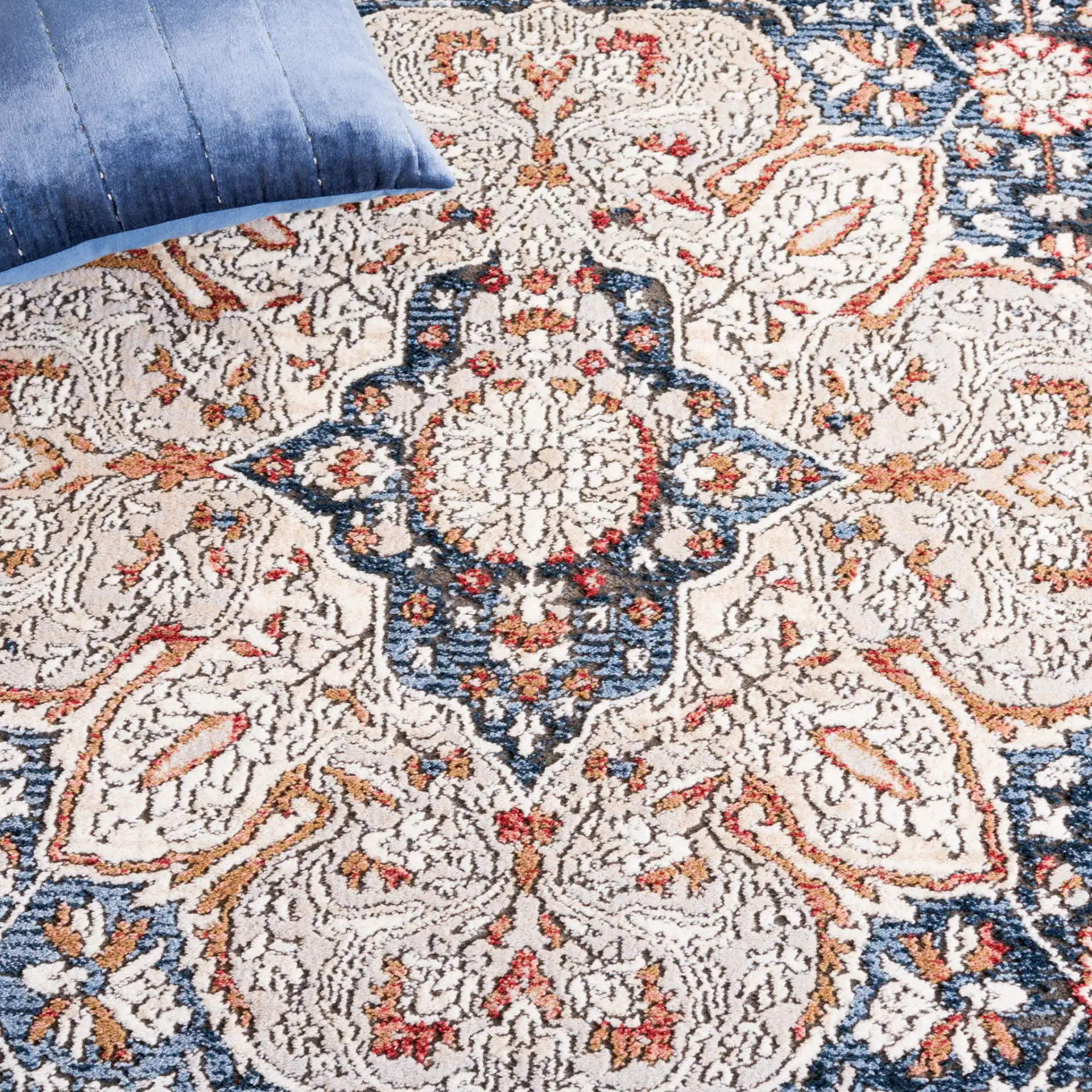 Rosewood Framed Medallion Rug in Ivory / Blue in a styled room