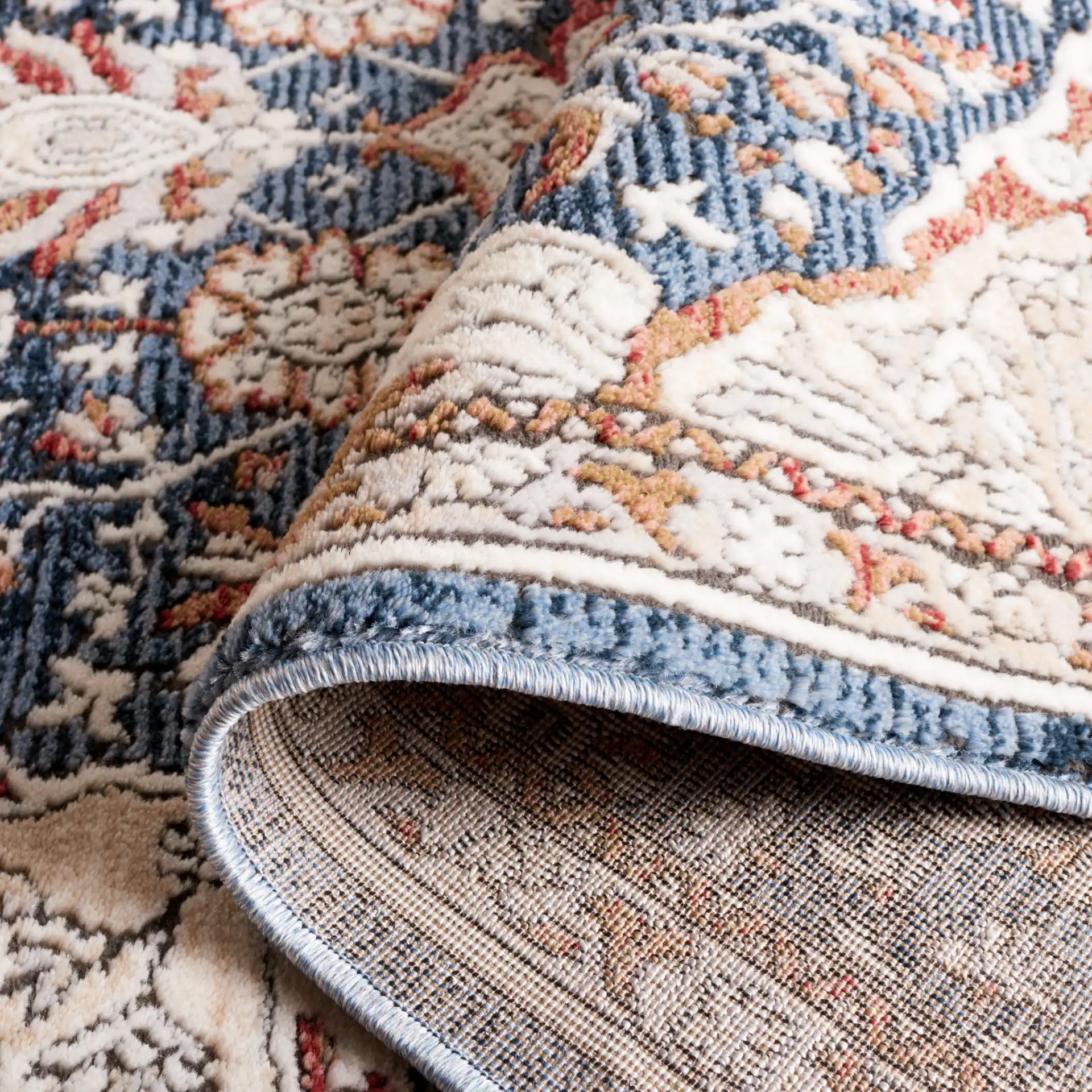 Rosewood Framed Medallion Rug in Ivory / Blue in a styled room