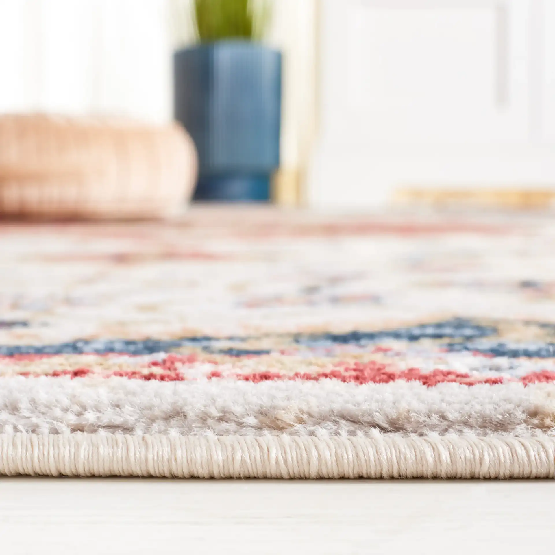 Rosewood Floral Medallion Rug in Ivory / Red in a styled room
