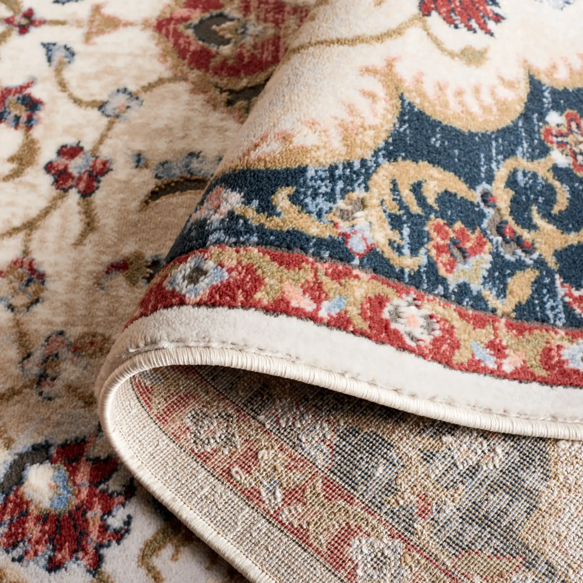 Rosewood Floral Medallion Rug in Ivory / Red in a styled room