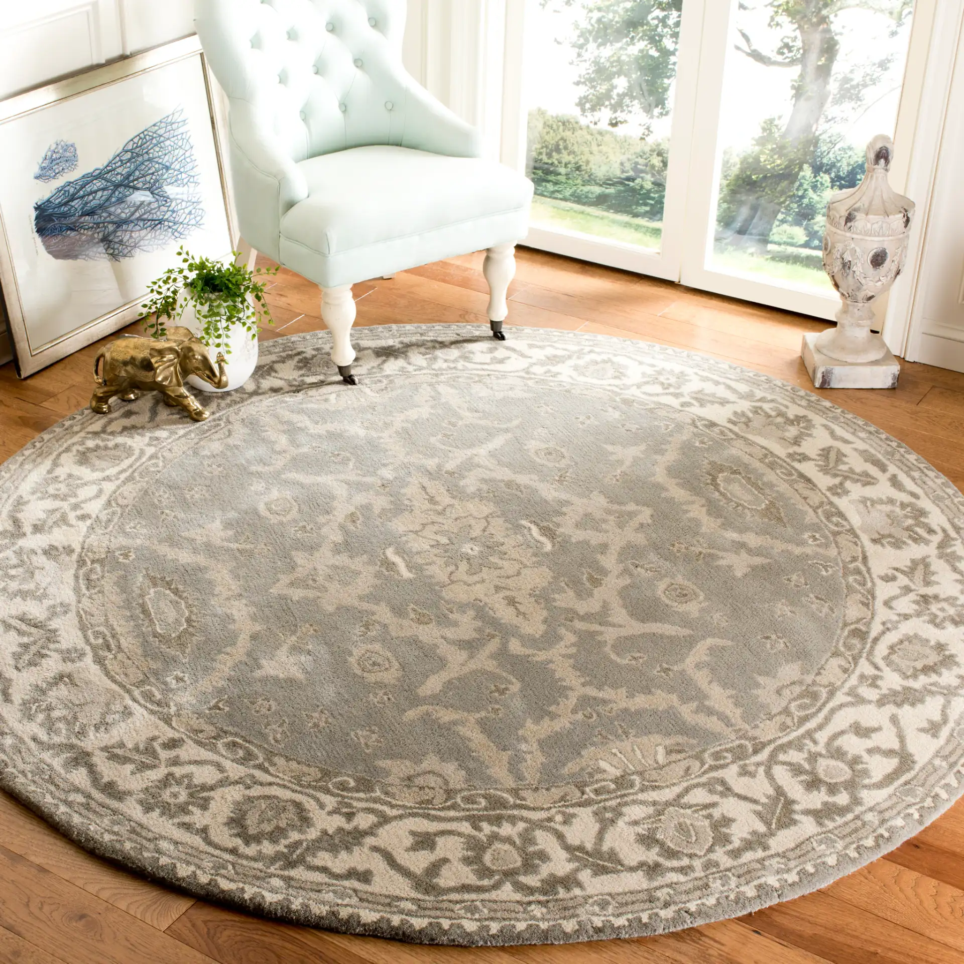 Royalty Palmette Bordered Hand-Tufted Wool Rug in Gray / Cream in a styled room