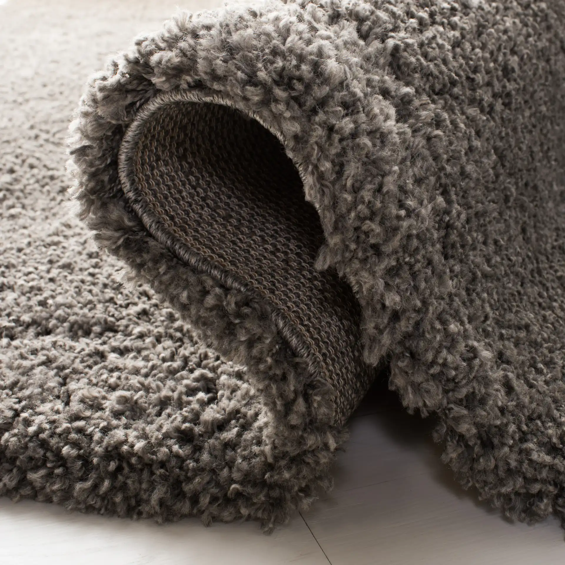 Royal Solid Shag Rug in Dark Gray in a styled room