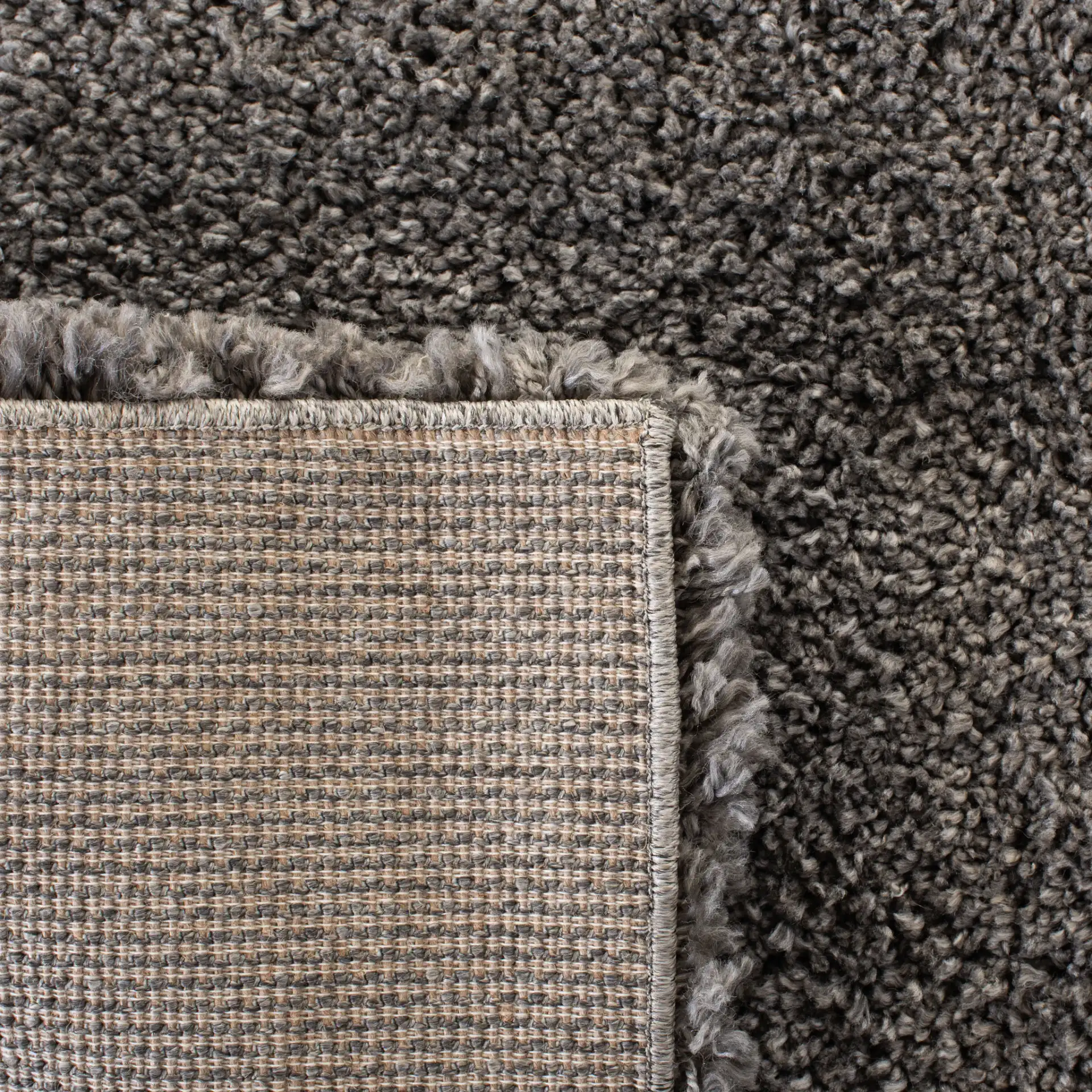 Royal Solid Shag Rug in Dark Gray in a styled room