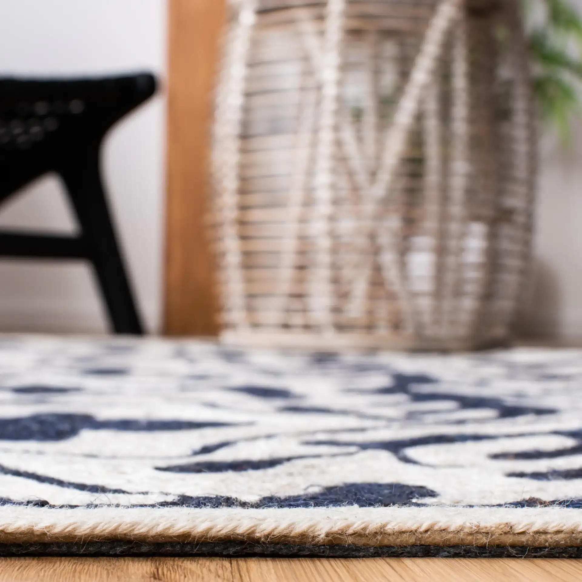 Sahara Trellis Hand-Tufted Rug in Navy / Ivory in a styled room