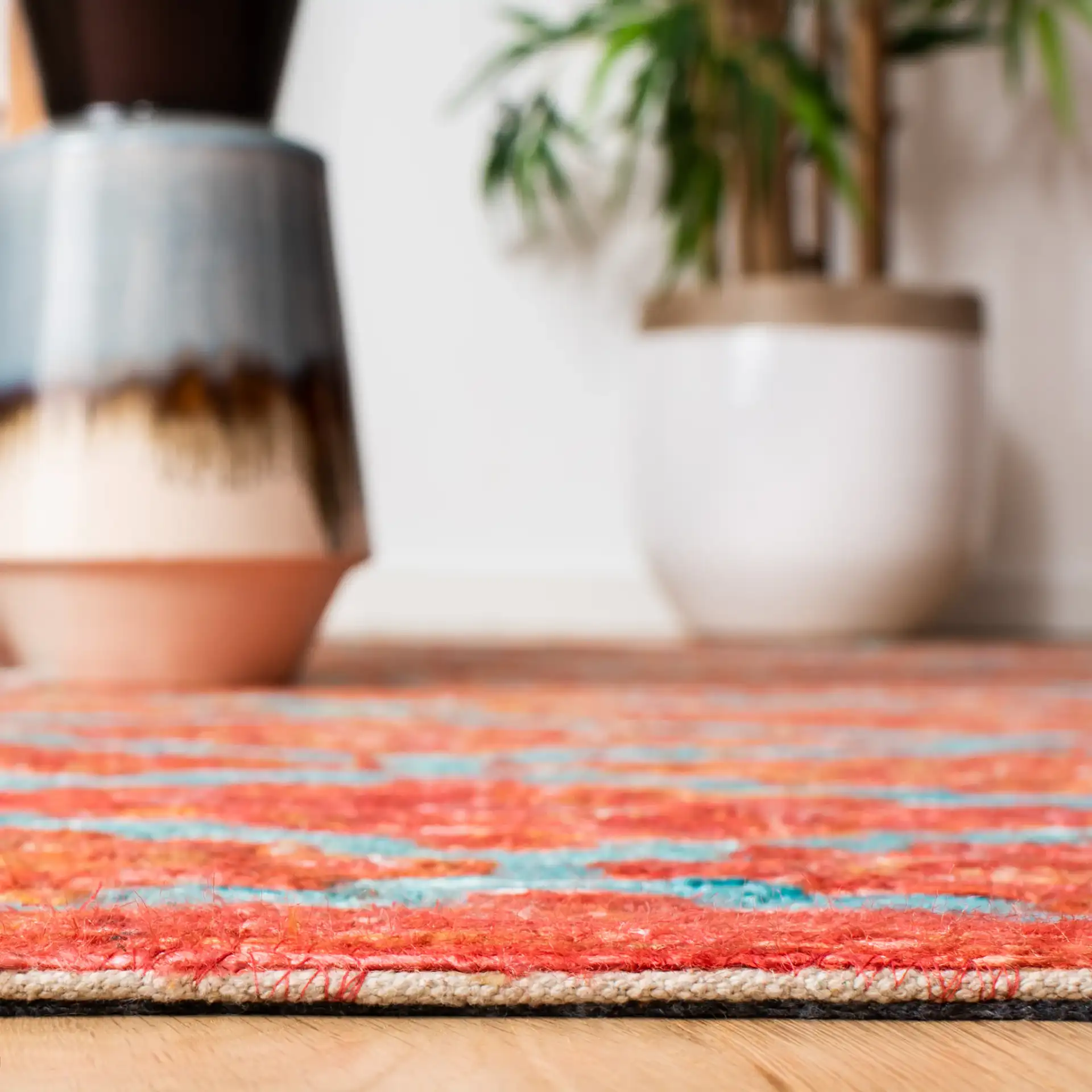 Sahara Stepped Diamond Hand-Tufted Rug in Rust / Aqua in a styled room