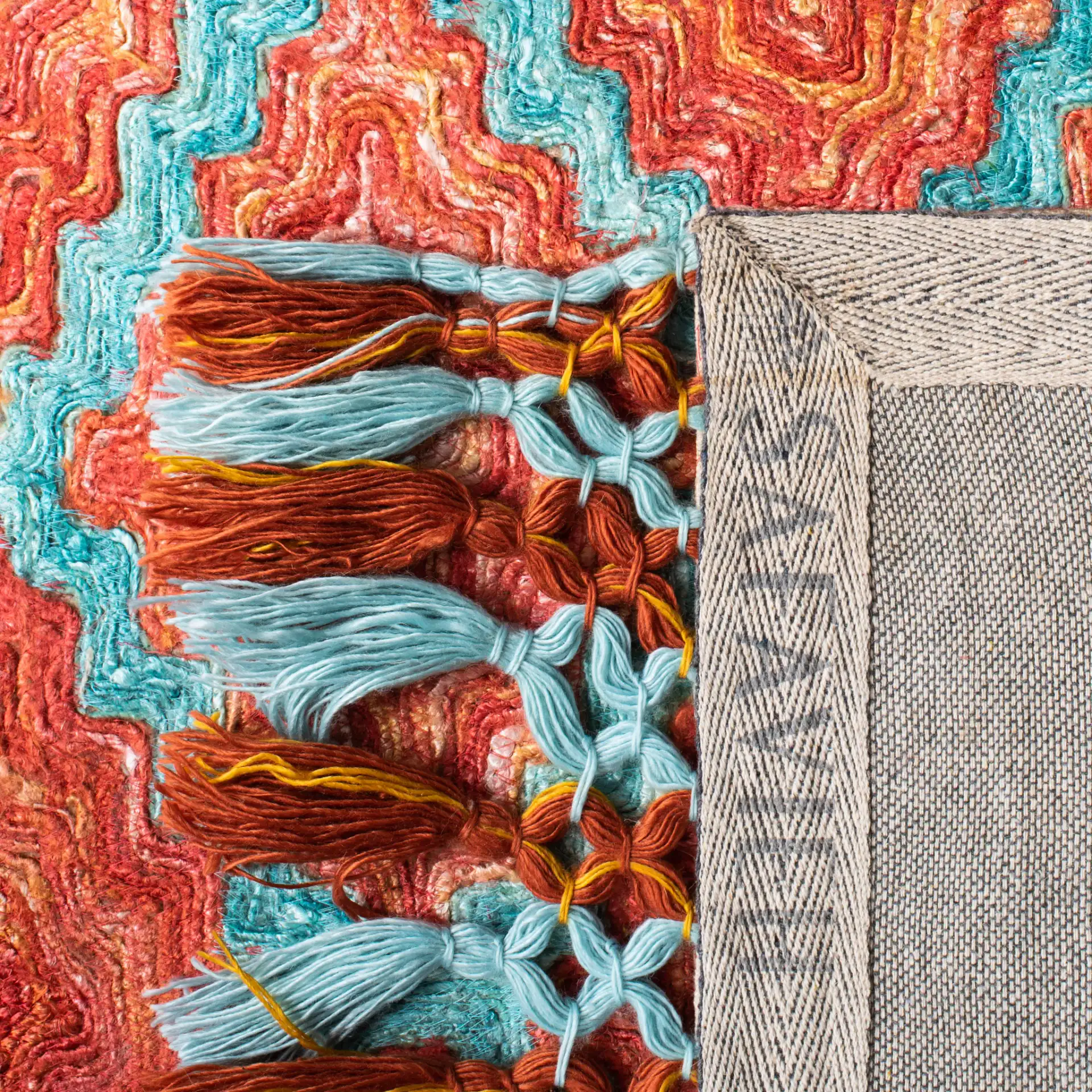 Sahara Stepped Diamond Hand-Tufted Rug in Rust / Aqua in a styled room