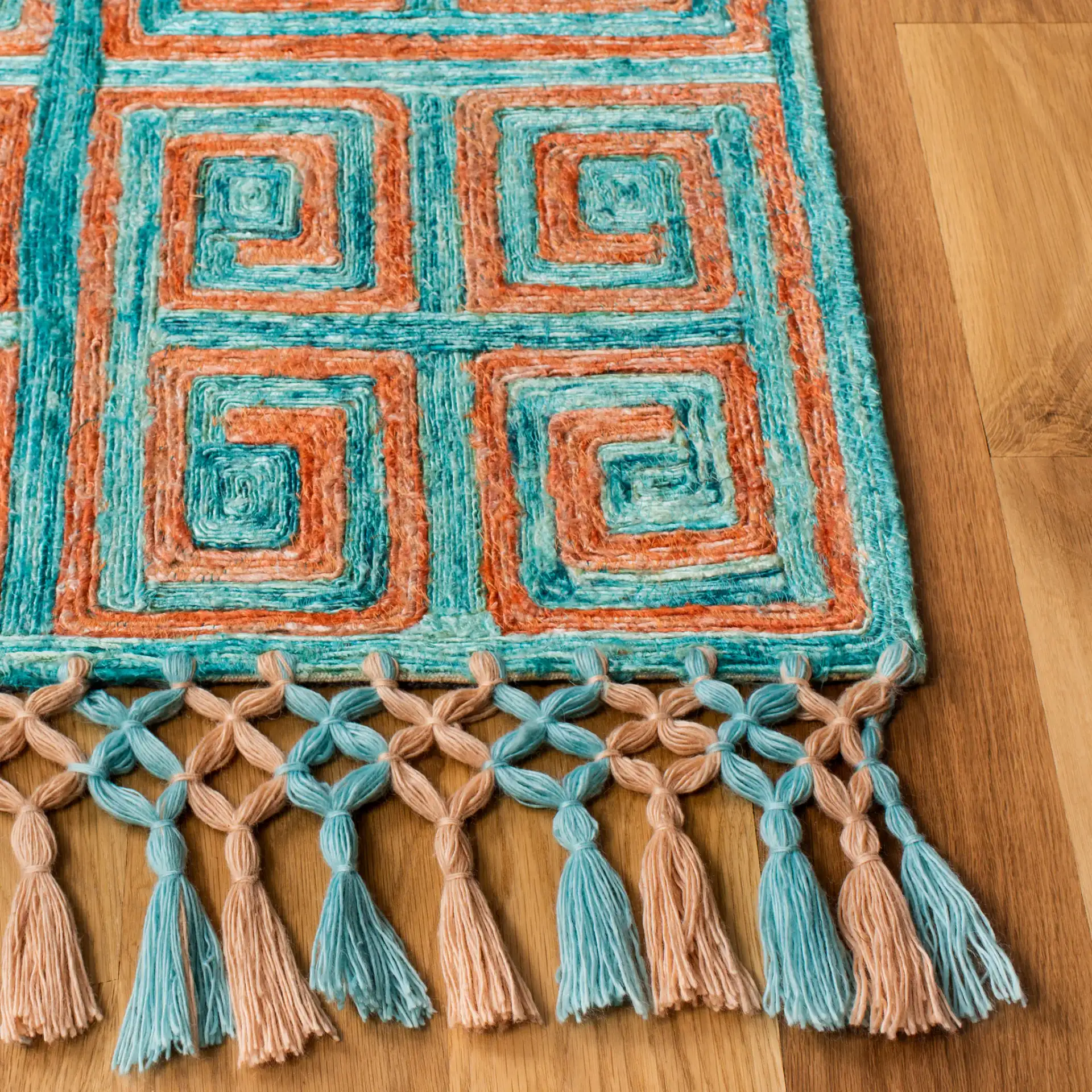 Sahara Greek Key Hand-Tufted Rug in Rust / Aqua in a styled room