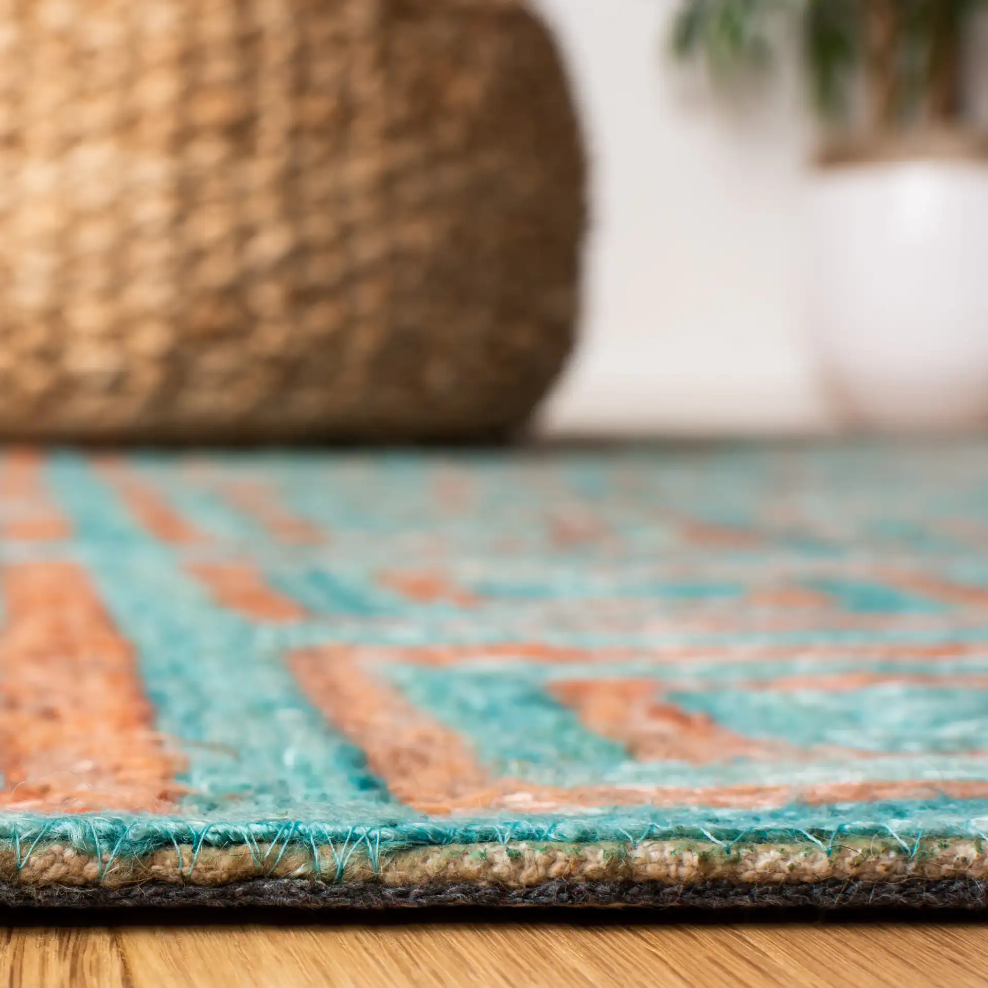 Sahara Greek Key Hand-Tufted Rug in Rust / Aqua in a styled room