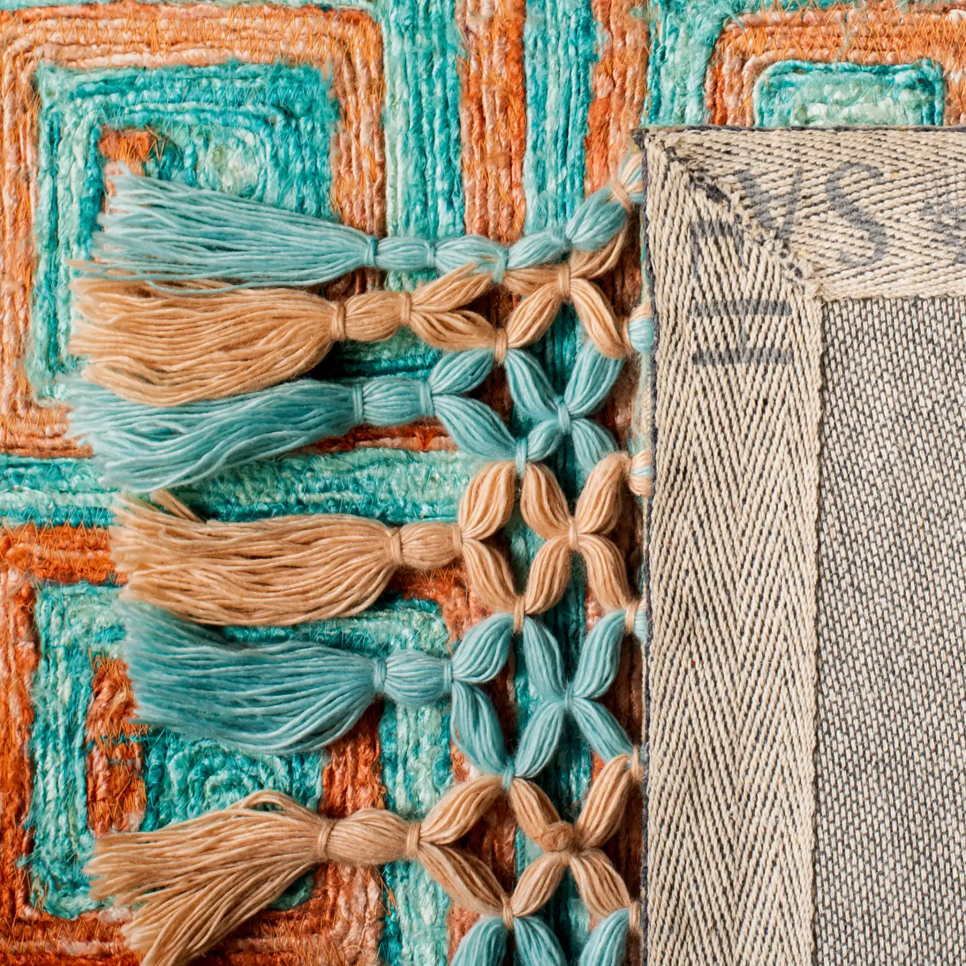 Sahara Greek Key Hand-Tufted Rug in Rust / Aqua in a styled room
