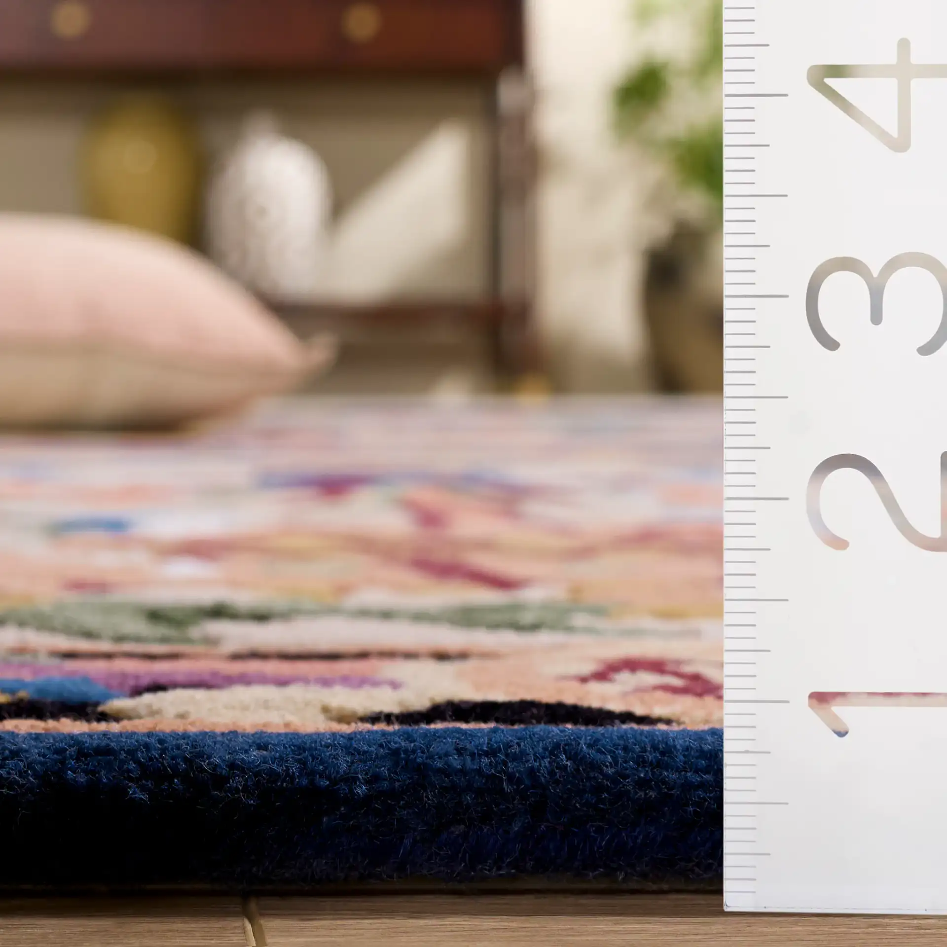 Savonnerie Scroll Medallion Hand-Tufted Rug in Ivory / Orange in a styled room