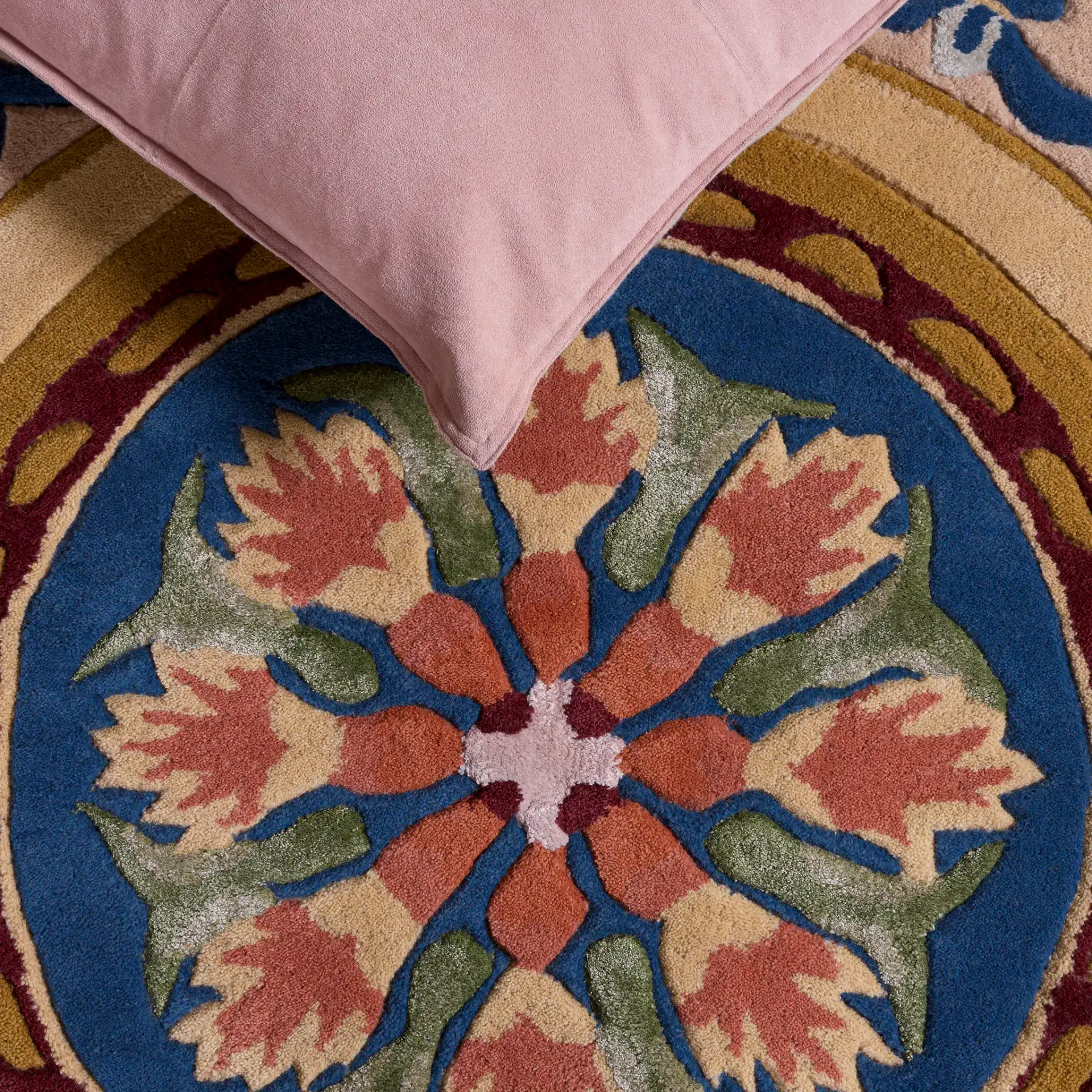 Savonnerie Scroll Medallion Hand-Tufted Rug in Ivory / Orange in a styled room