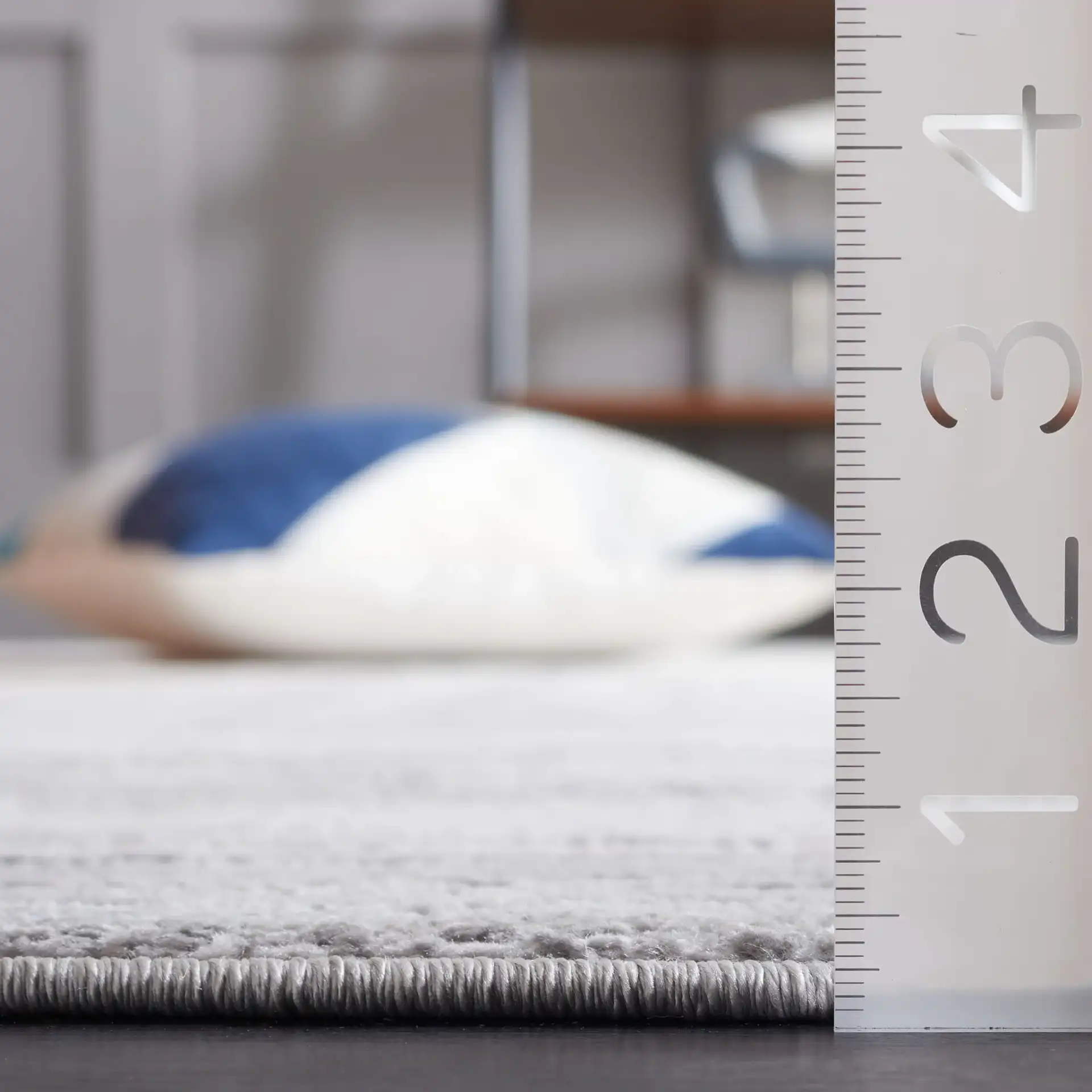 Saylor Concentric Rectangles Rug in Gray / Ivory in a styled room
