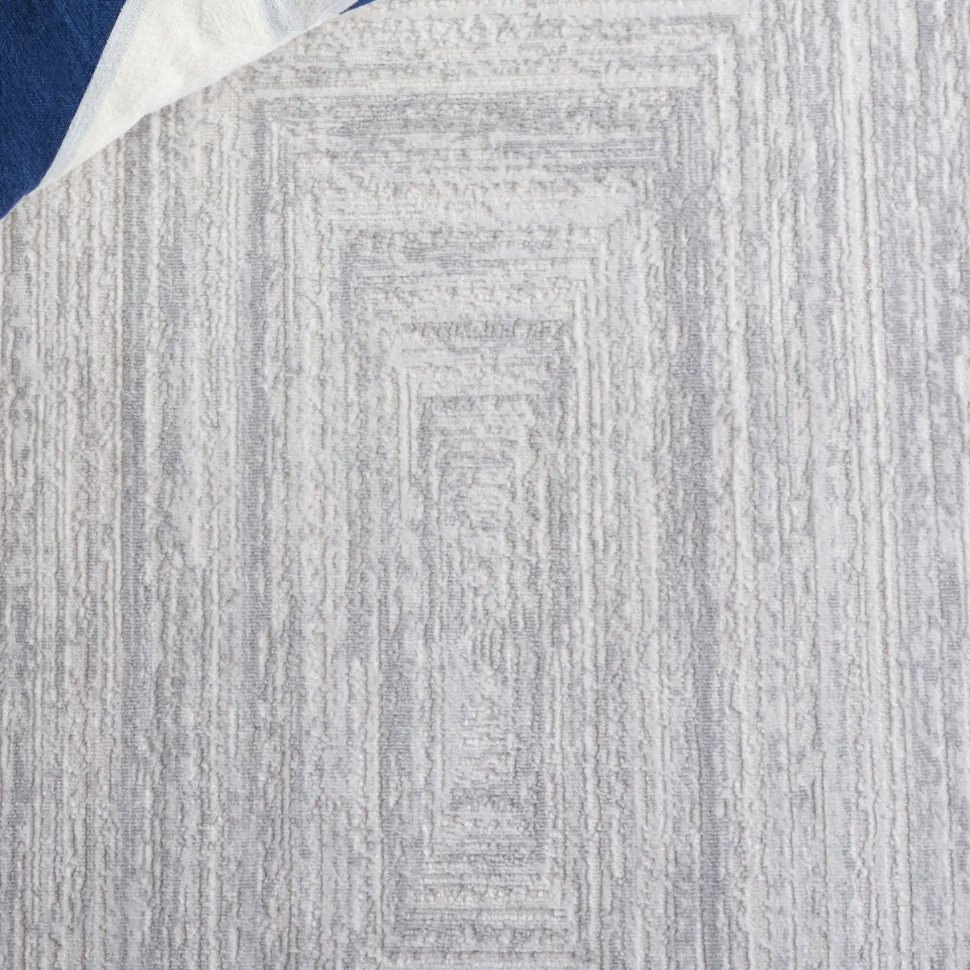 Saylor Concentric Rectangles Rug in Gray / Ivory in a styled room