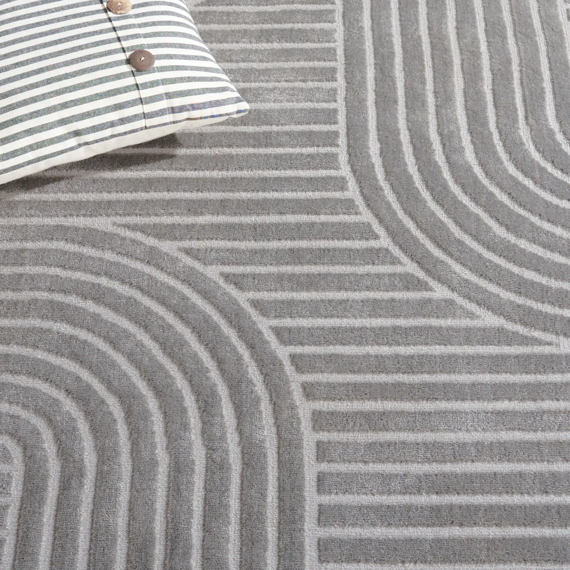 Saylor Arched Stripe Rug in Gray in a styled room