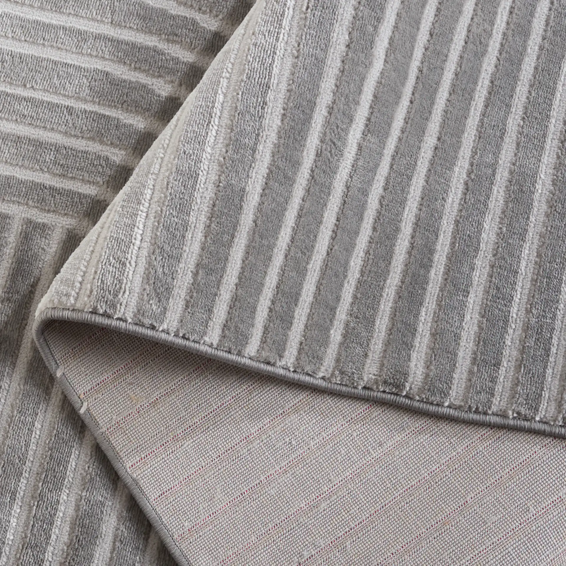 Saylor Arched Stripe Rug in Gray in a styled room