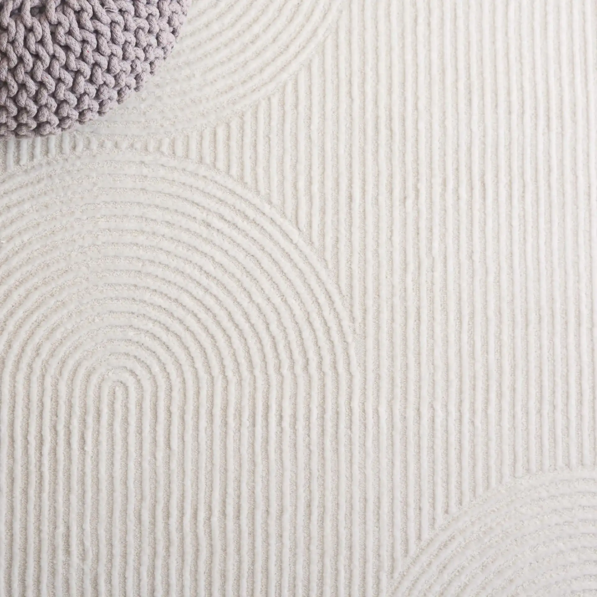 Saylor Concentric Circles Rug in Ivory in a styled room