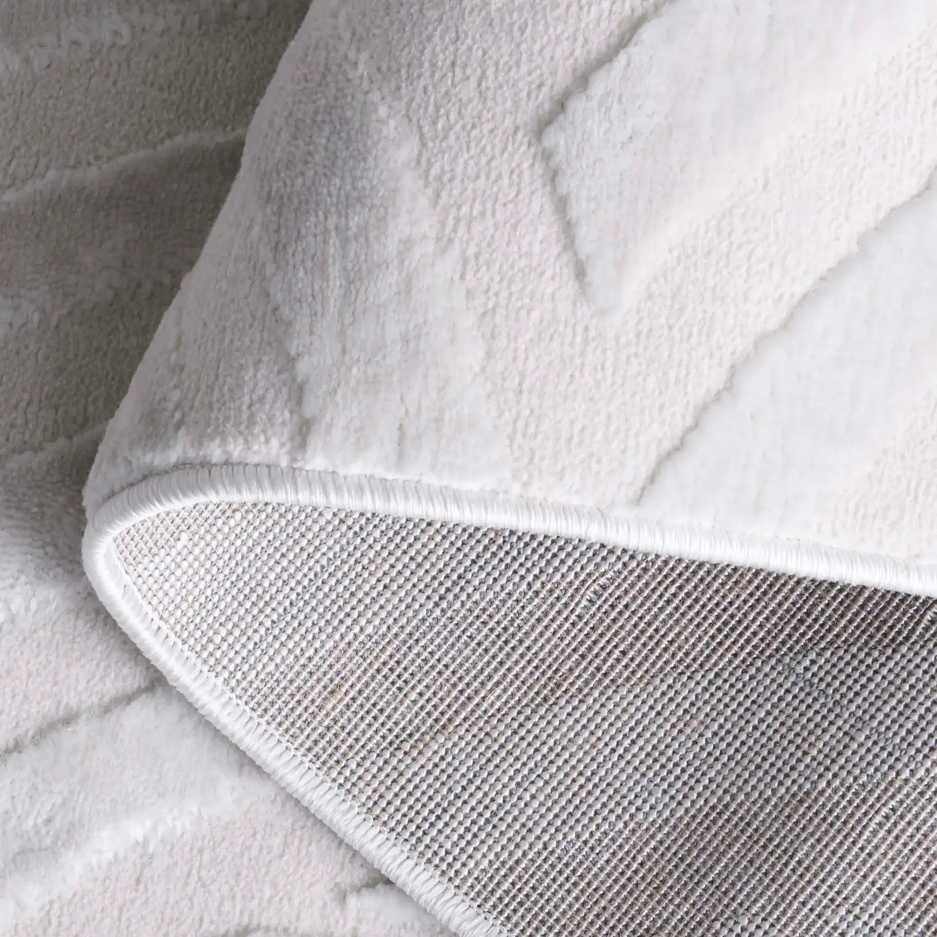 Saylor Intersecting Arcs Rug in Ivory in a styled room