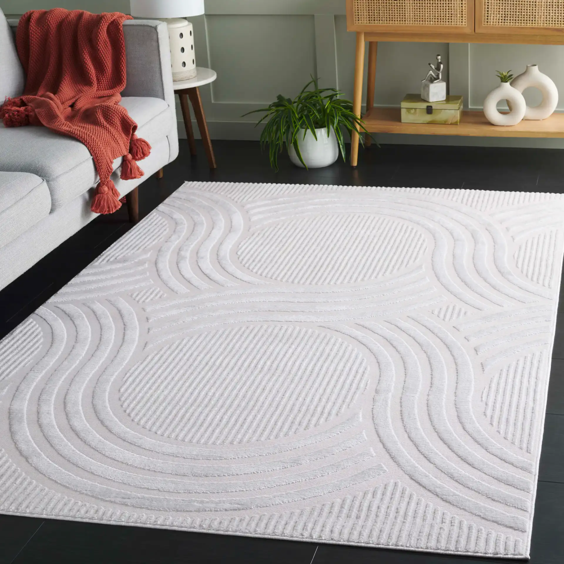 Saylor Intersecting Arcs Rug in Ivory in a styled room